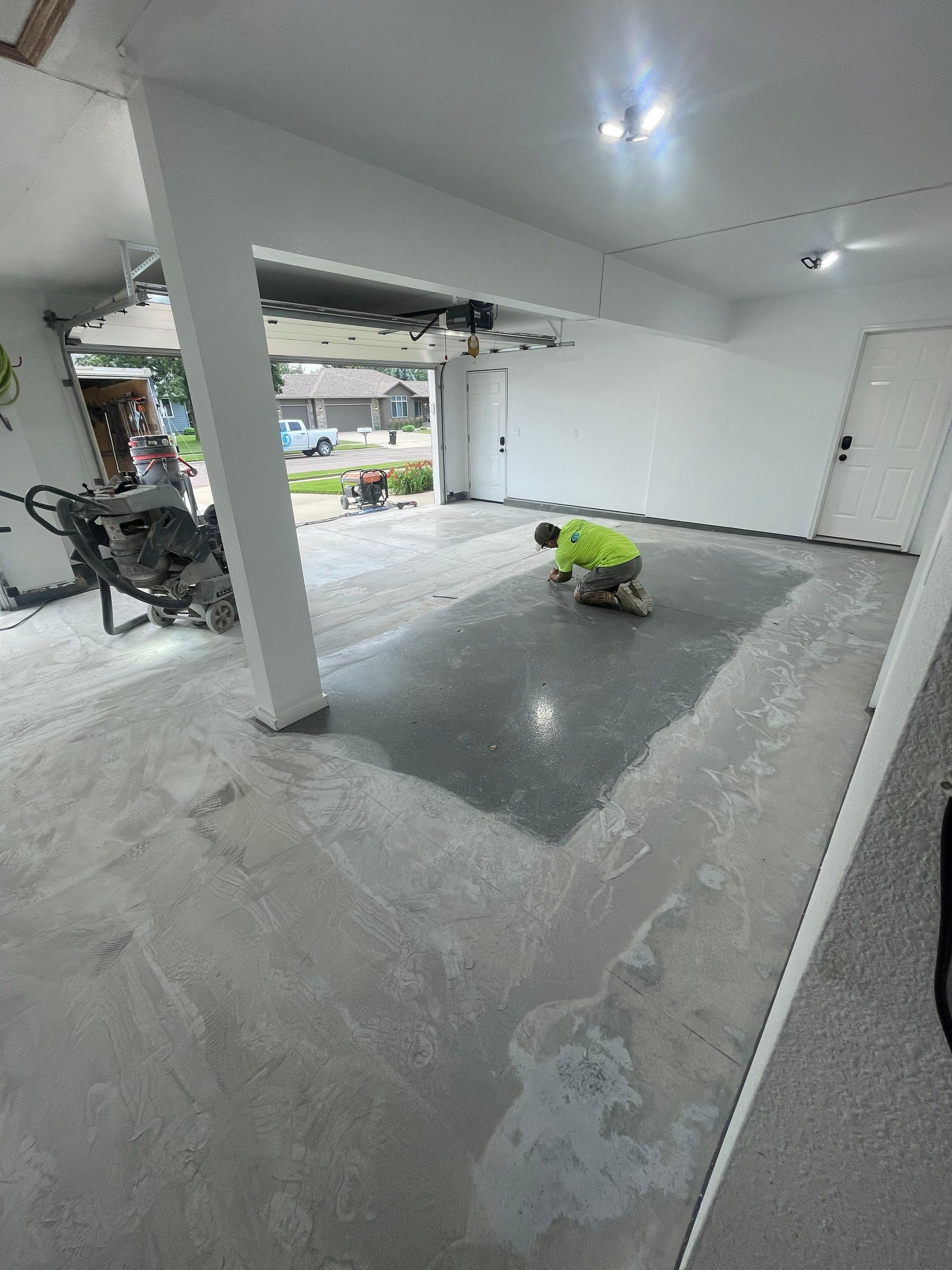 Multi-Car Garage Concrete Coating with Coyote Flake Finish in Sioux Falls by Select Painting, Coatings & Garage Cabinets