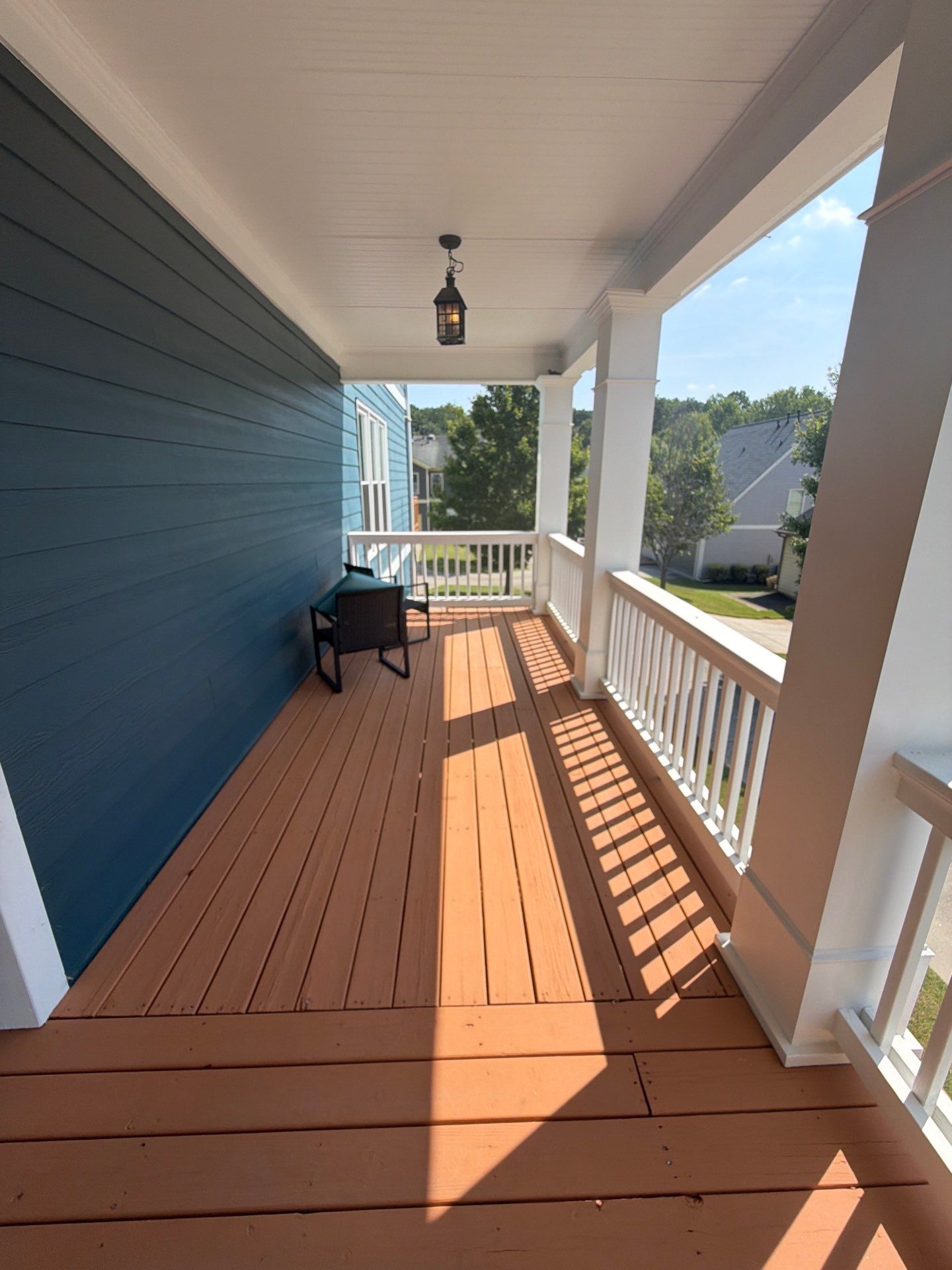 Atlanta Exterior Home Refresh with Blue Siding and Deck Staining by Swift Home Renovations 