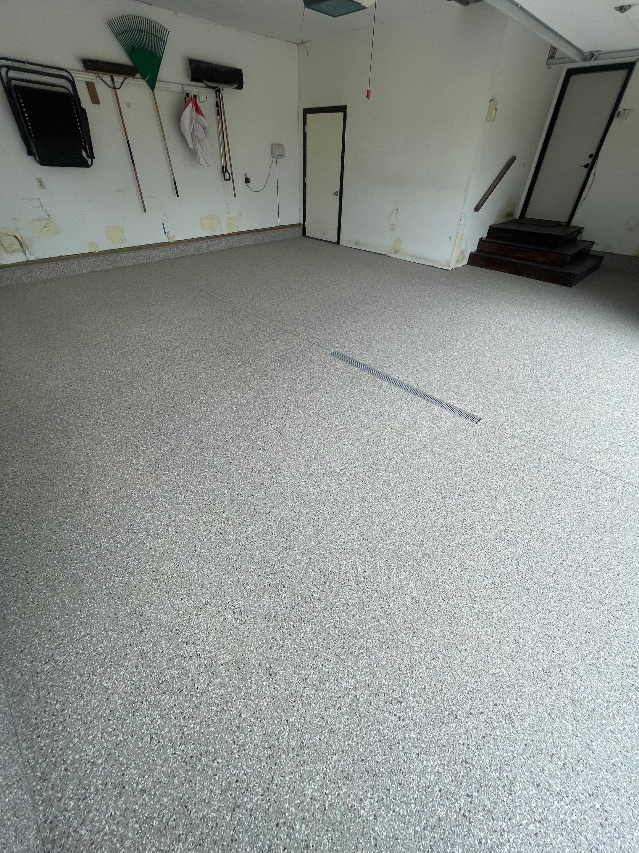 Hartford Residential Garage Floor Transformation With Decorative Chip Coating by Select Painting, Coatings & Garage Cabinets