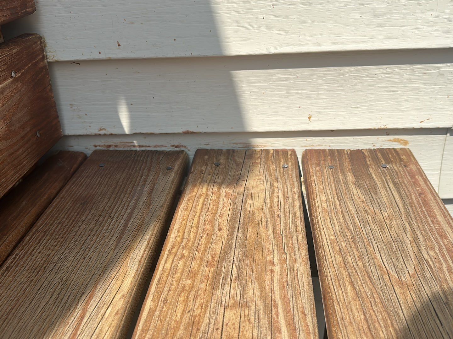 Wood cleaning and staining using Armstrong cloark oil stain by Northern Power Washing LLC.