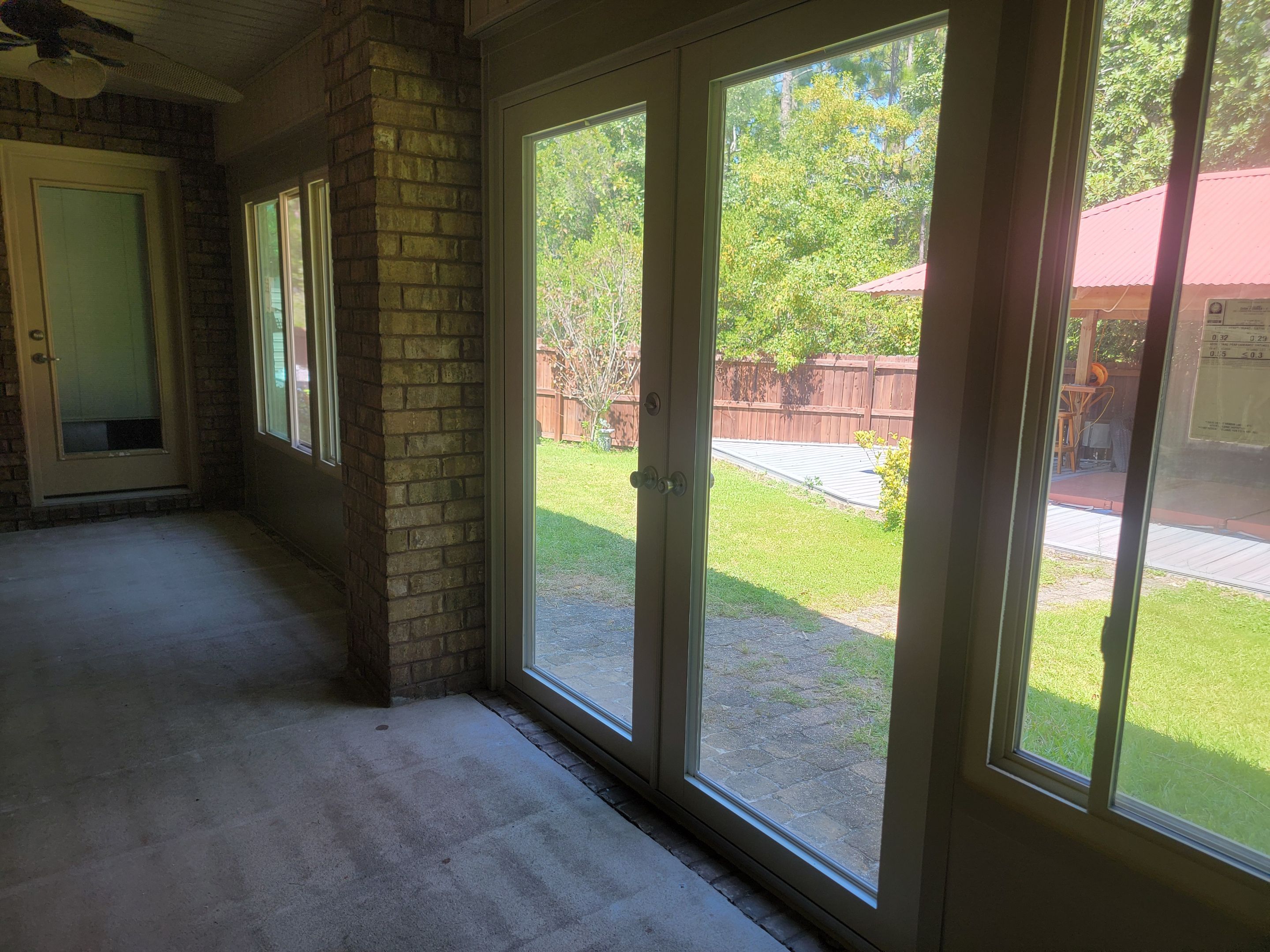 Glass Sunroom Constructed Under Existing Roof by Titan Sunrooms