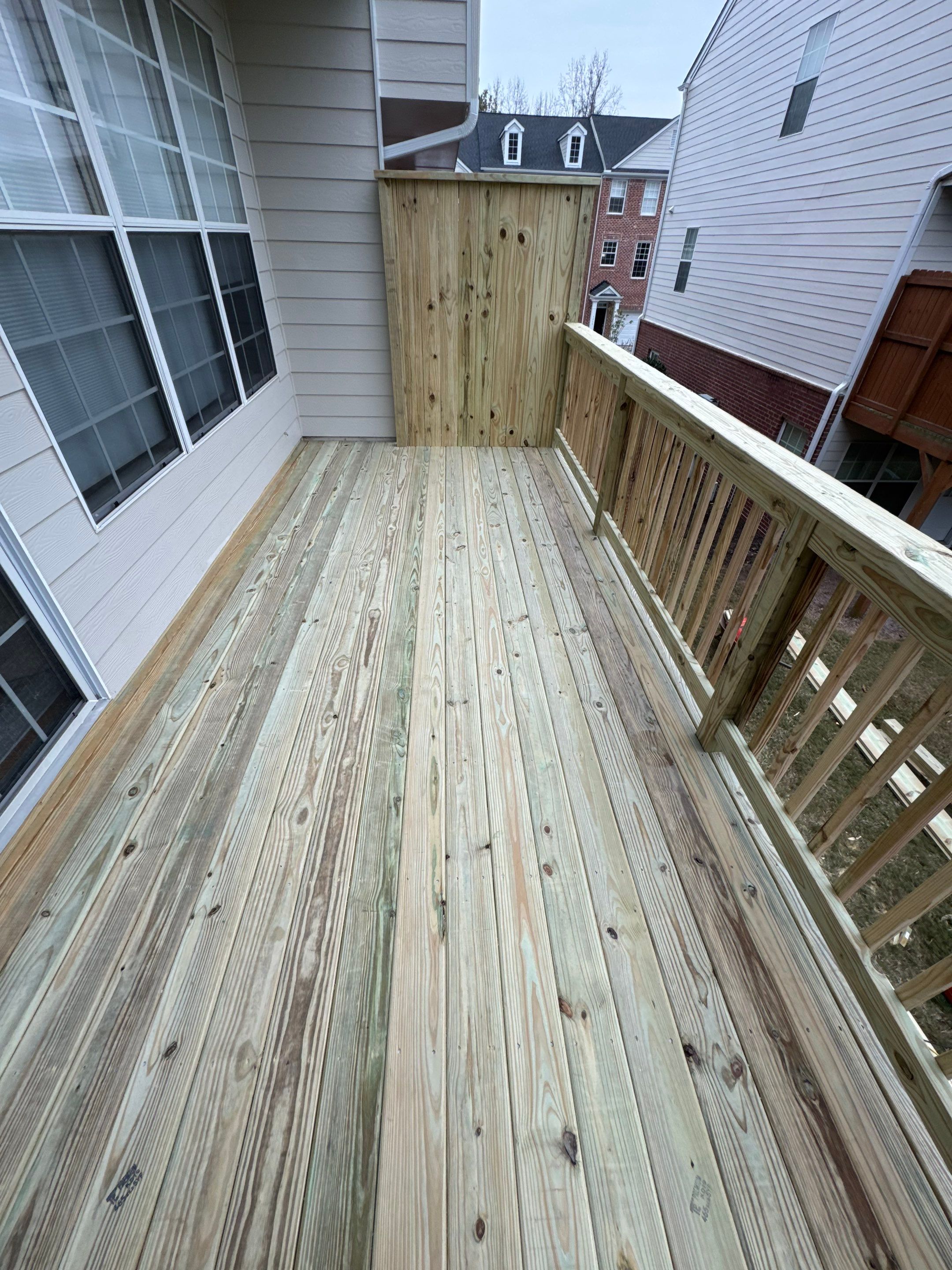 New Second-Story Pressure-Treated Wood Deck Installation in Atlanta by Swift Home Renovations