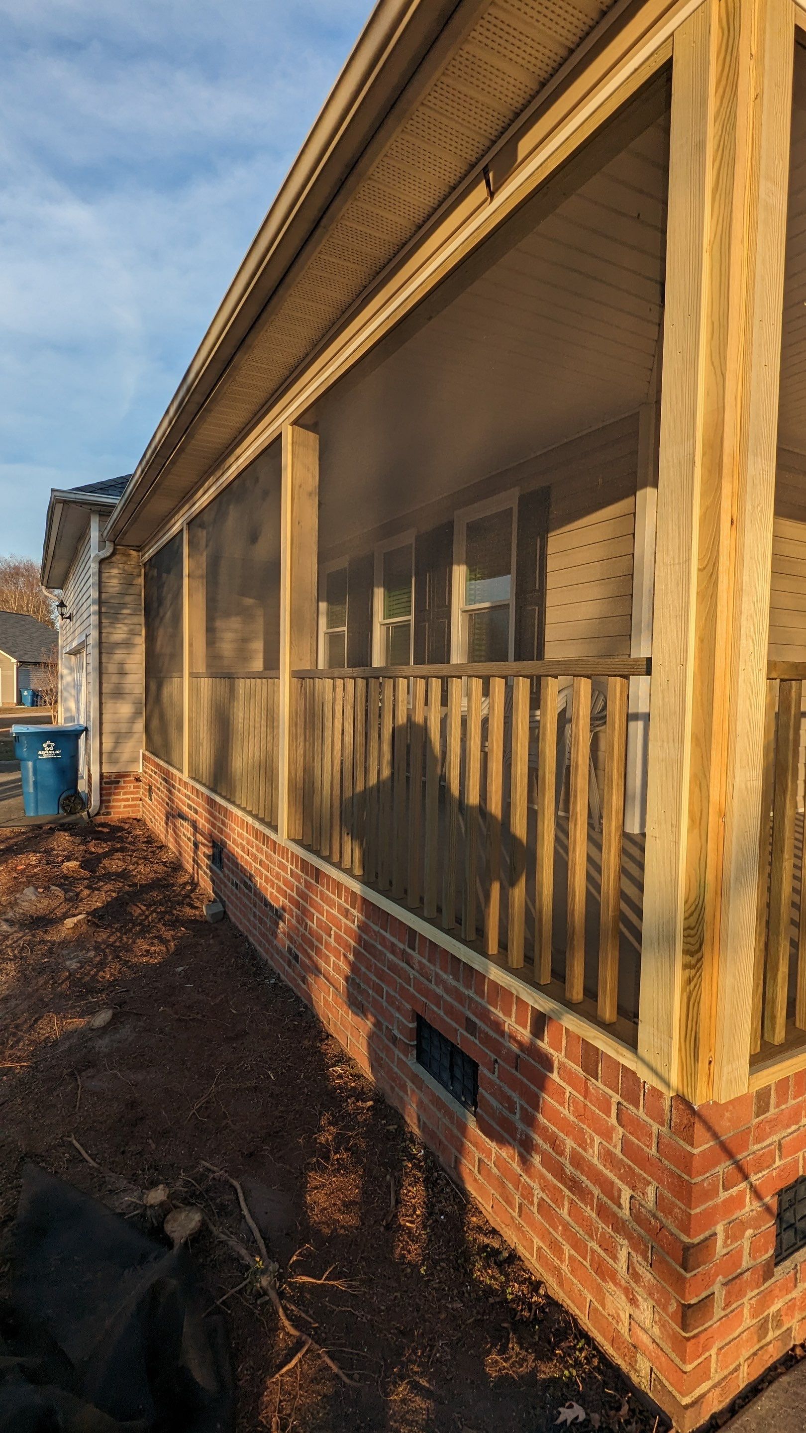 Custom Screened Porch Conversion with New Wood Railing in Dunn by The Remodeling Company