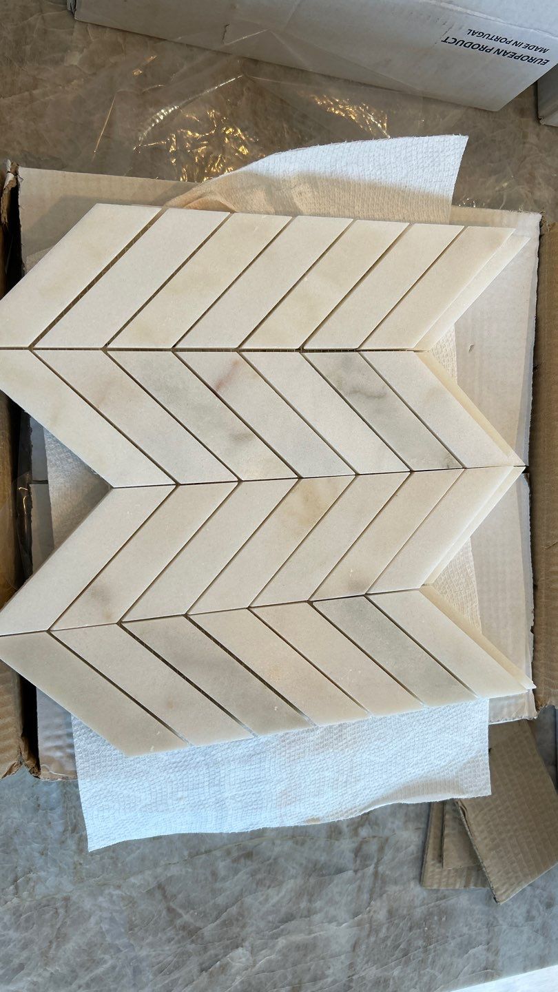 Lovely neutral backsplash  by Footprints Floors of Nashville