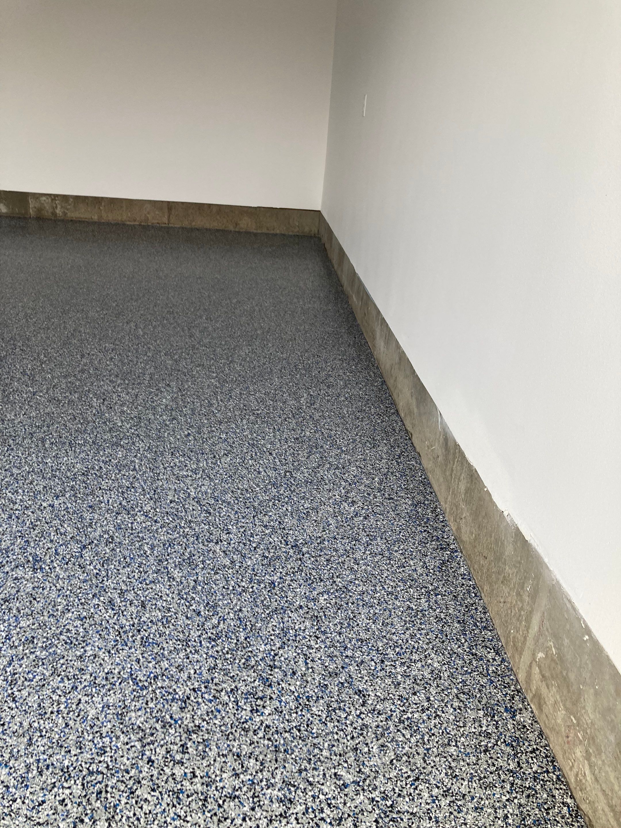 Garage Transformation using Domino with Blue by Croc Coatings, LLC