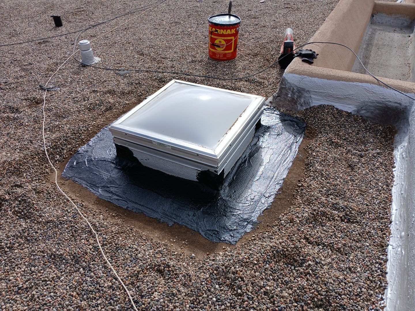 Roof Maintenance and Low-E Tempered Glass Skylight Replacement on Gravel Roof in Northwest Albuquerque by Doyle Roof Masters Inc