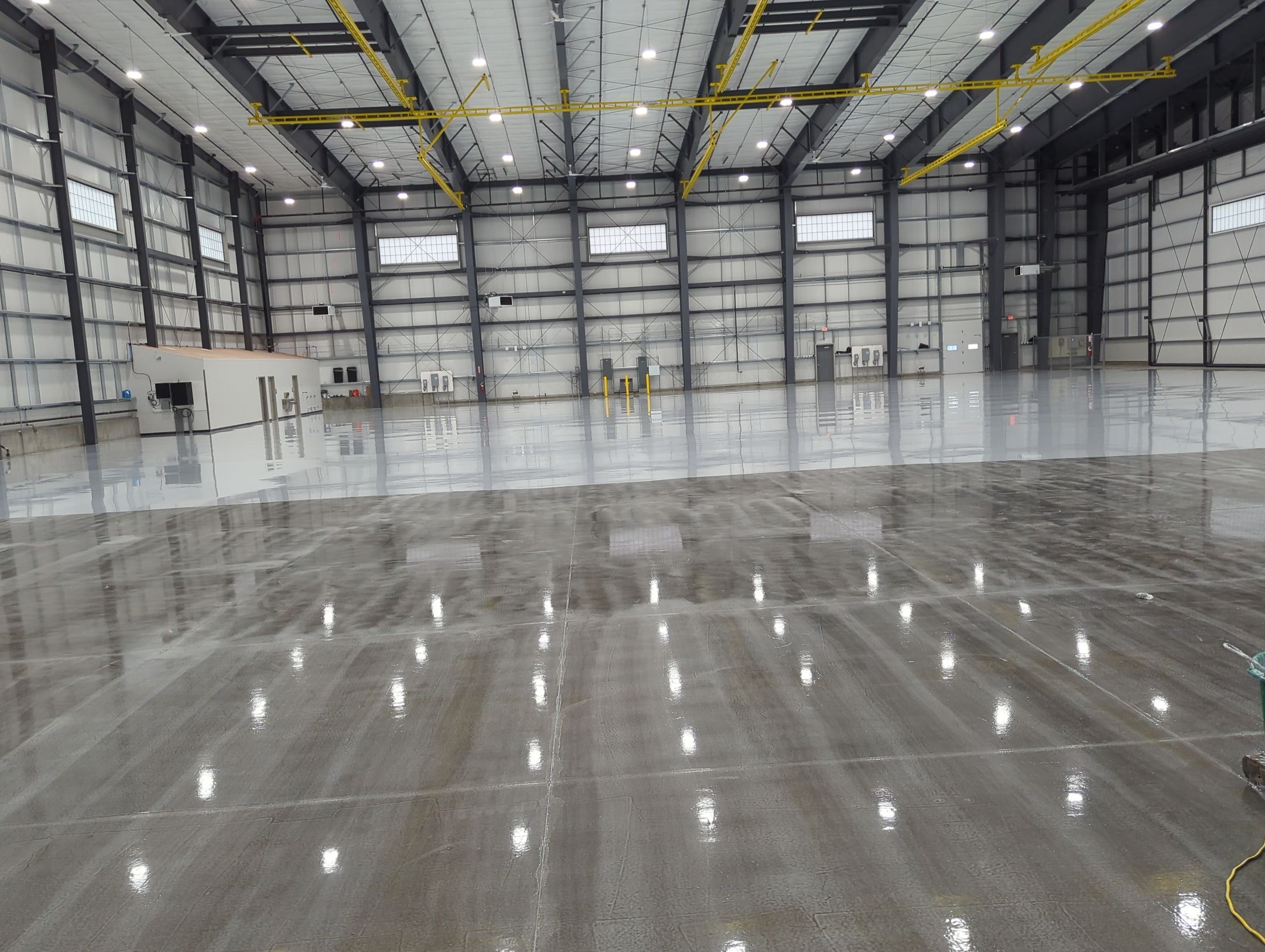Airplane Hanger using Light Grey Commercial Penntek Epoxy by Croc Coatings, LLC