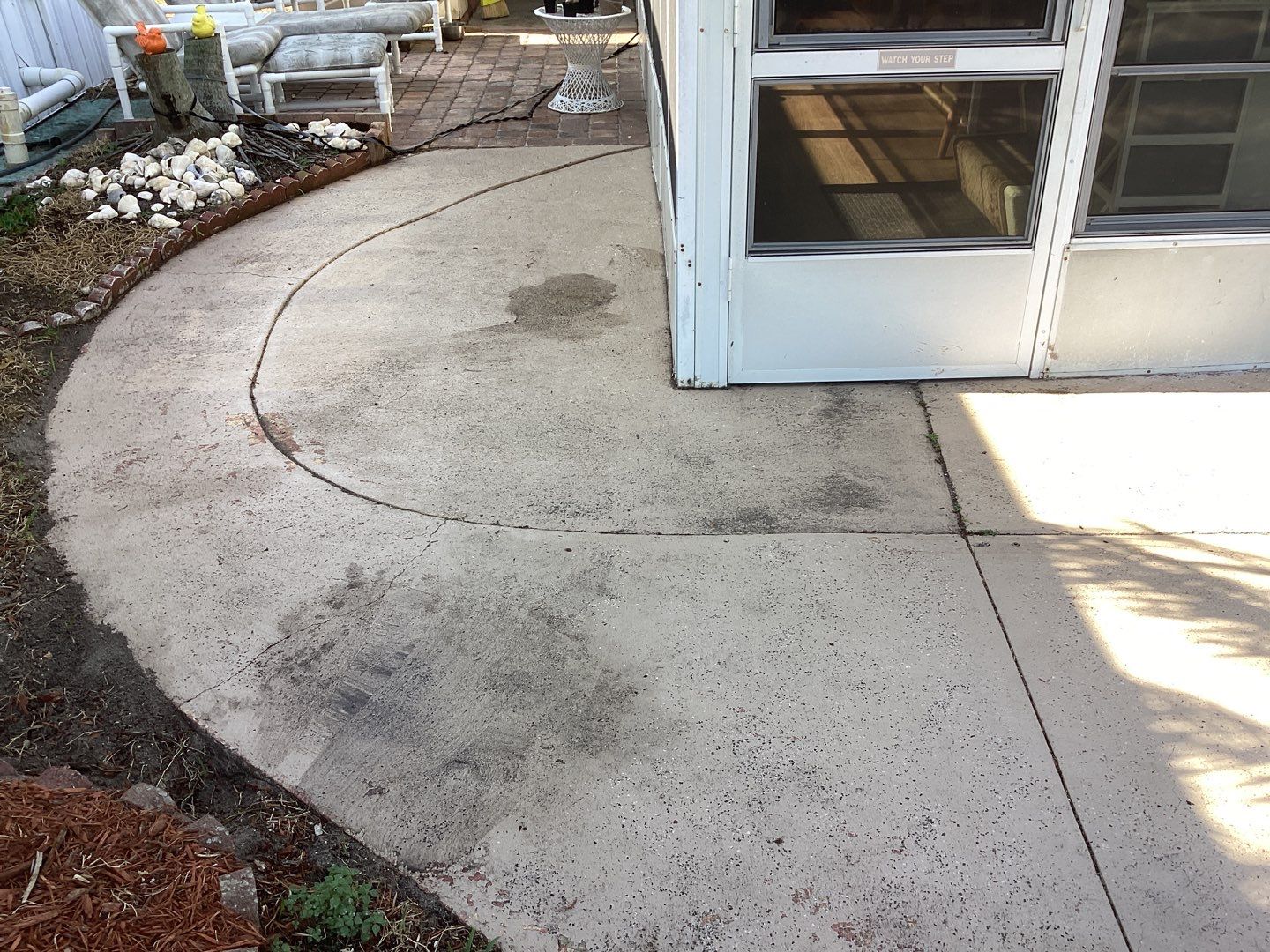Driveway using Pebble Beach by Amvet concrete coatings llc