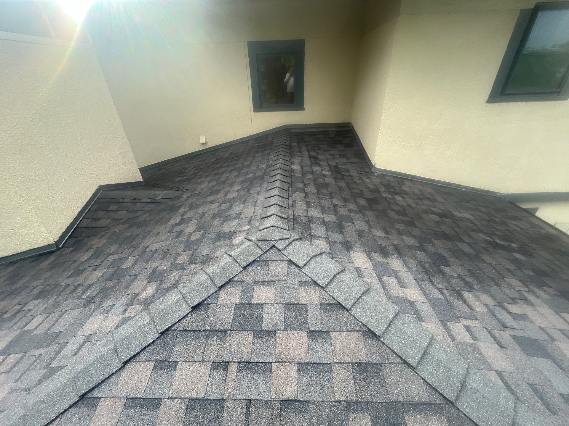 Tan exterior with IKO Driftshake by Tejas Roofworks + Restoration