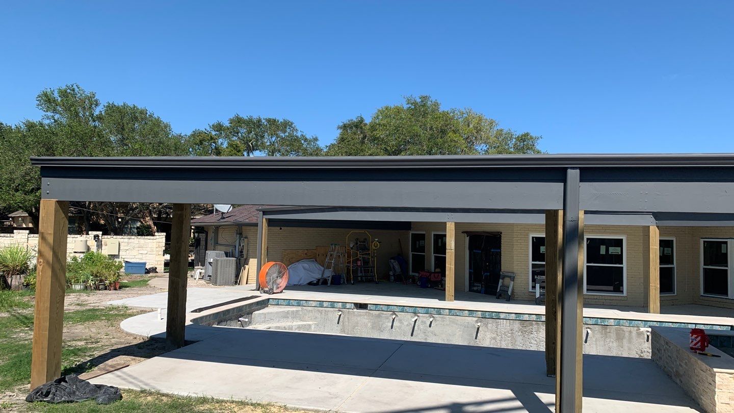 Beautiful pool side build by Bayfront Roofing and Construction