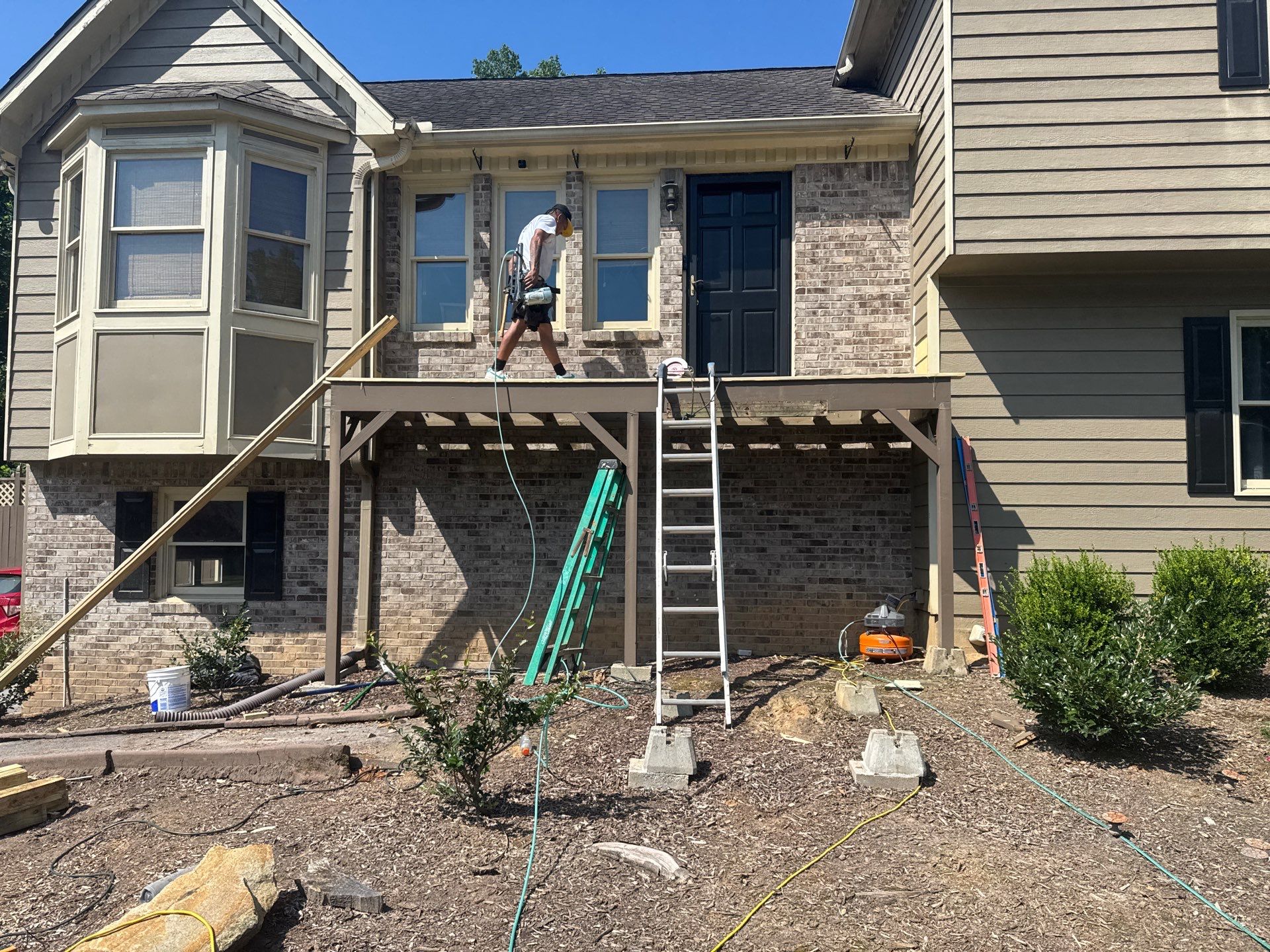Elevated Pressure-Treated Deck and Staircase Build in Powder Springs by Swift Home Renovations