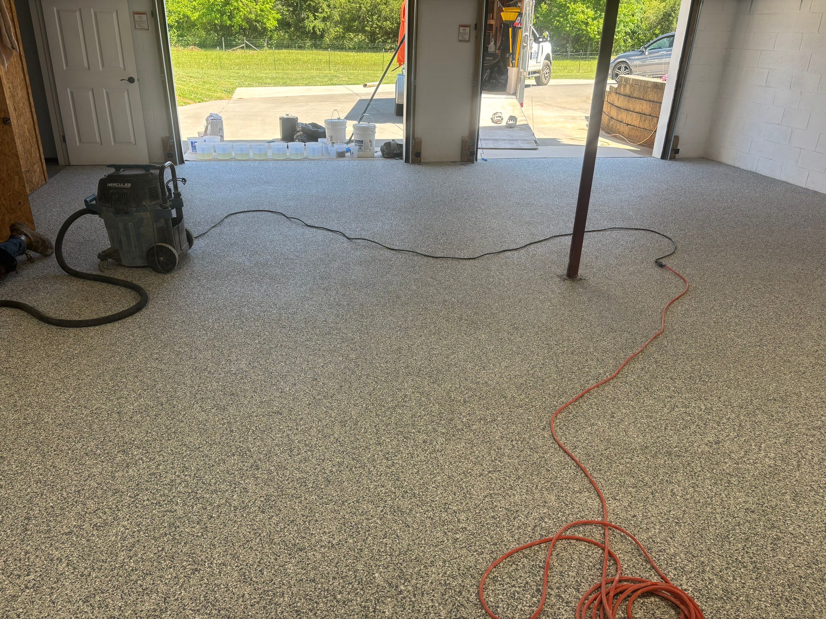 Garage Using Gravel  by Elite Floor Solutions