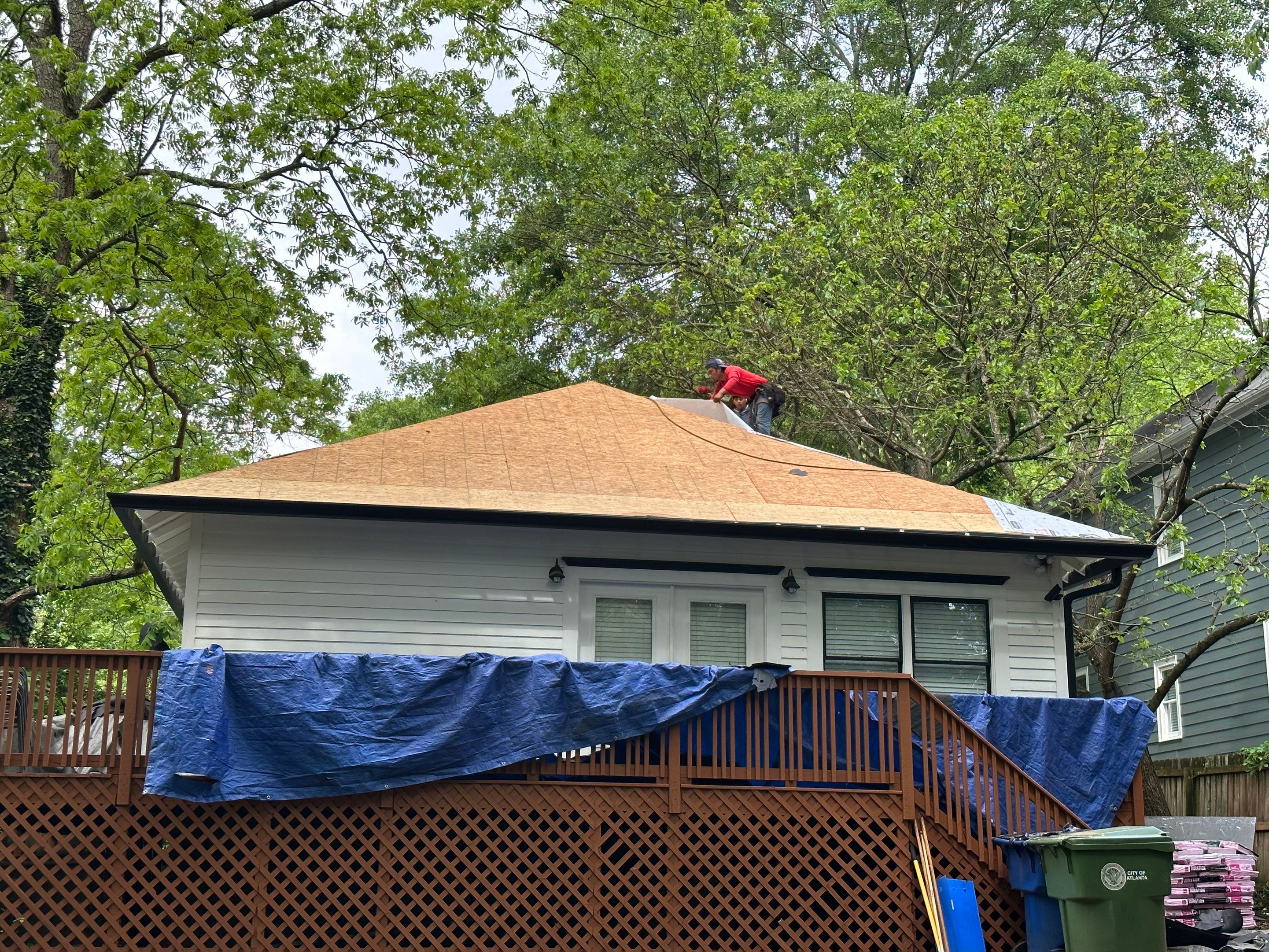 roof replacement and new black gutters by Nailed It Roofing & Remodeling LLC