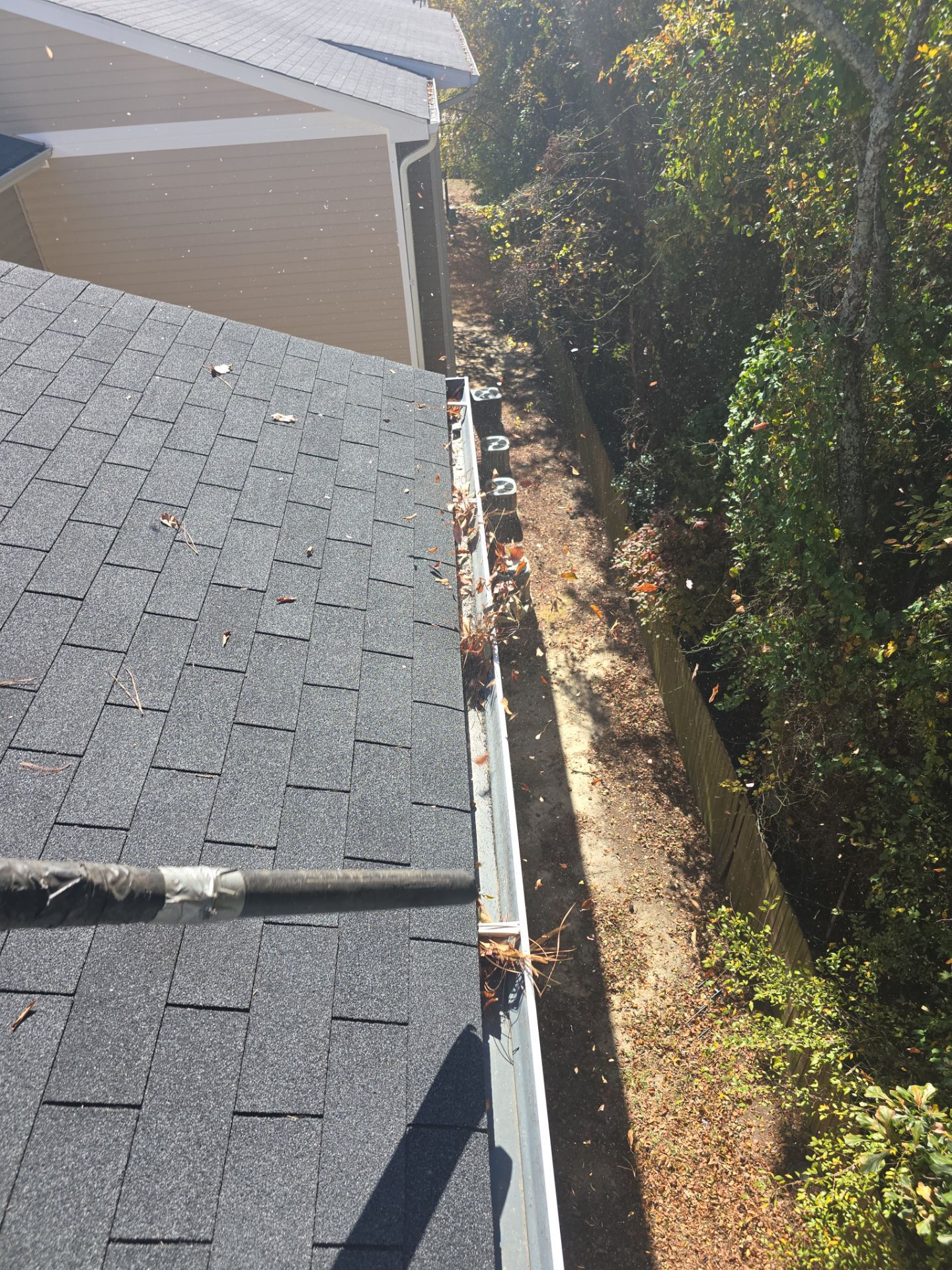 HOA gutter cleaning in Pinehurst & Southern Pines, NC,before photo showing full gutters.