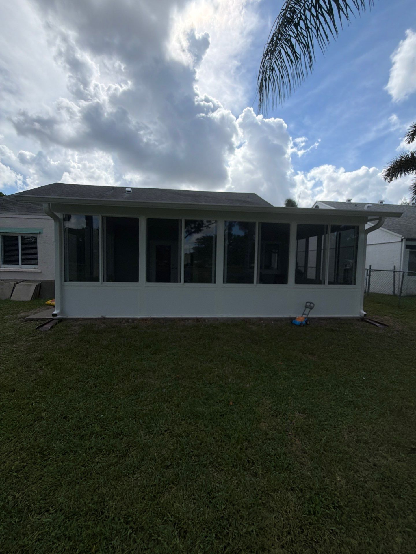 Custom Impact Sunroom With PGT Windows & Aluminum Insulated Roof in Boynton Beach by The Screen Depot, Inc