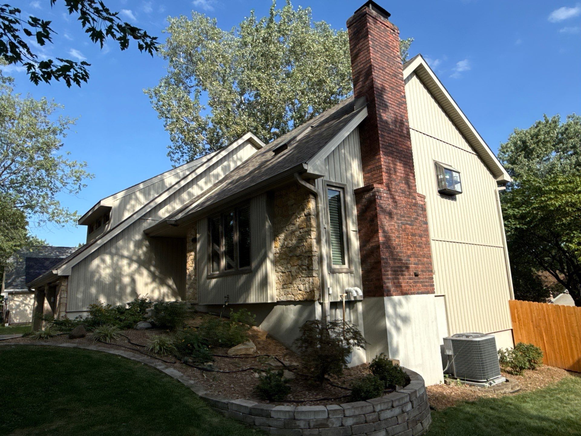 Comprehensive Kansas City Exterior Remodel Featuring Board And Batten Siding by EEC Windows, Siding & Roofing
