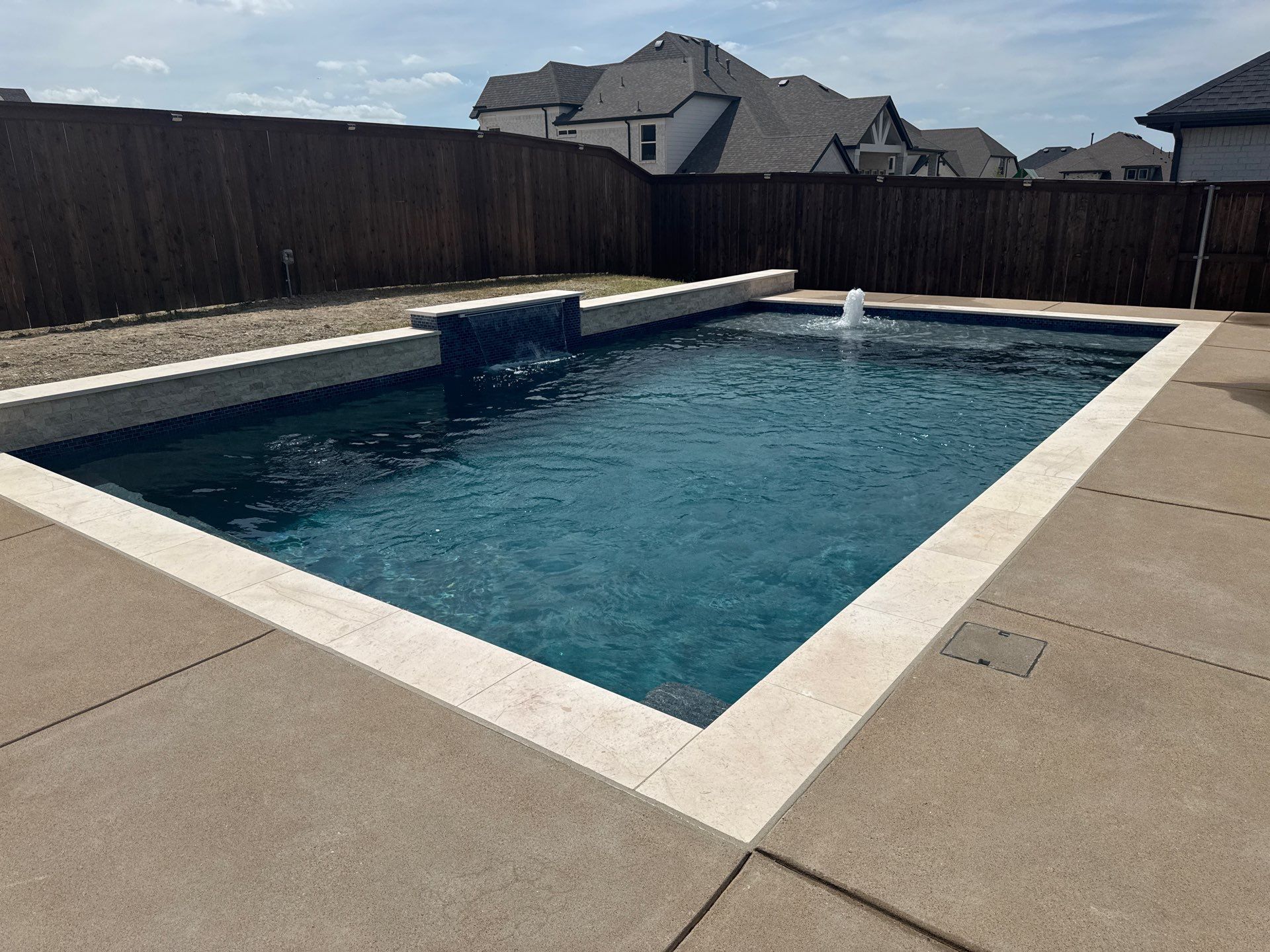 Geometric Pool with Tanning Ledge and Bubbler by Pinnacle Pools and Spas - DFW