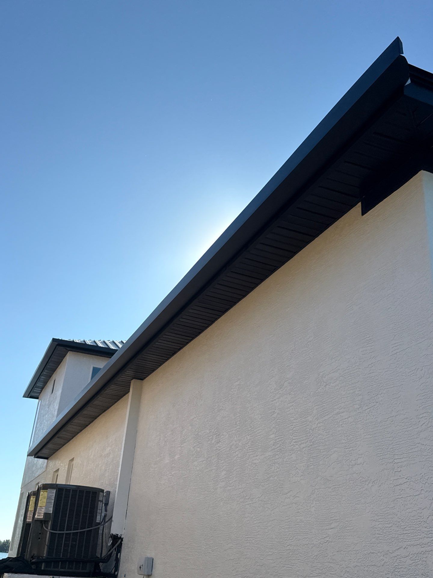 Soffit and Fascia Installation and black seamless gutters in Sarasota FL by Gutter Professors
