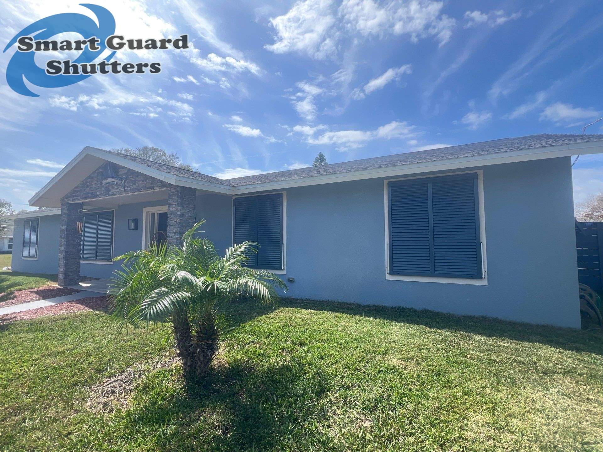 Impact Bahama Shutters in Grey Blue by Smart Guard Shutters