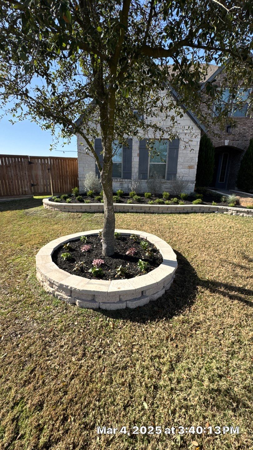 🌿✨ Darlene & Andrew’s Amazing Curb Appeal Transformation  Some projects are more than just landscaping—they’re a conversion of curb appeal from the ground up. For Darlene & Andrew, Alejandro and the Texas Urban Team designed and delivered a complete solution that reshaped their flower beds, solved drainage challenges, and gave new life to the sideyard.  💡 From planning to execution, every step was tailored to build both beauty and functionality:  🌸 Flower Beds, Reinvented  Demolition of old beds, plants, and mulch.  Fresh soil preparation, weed protection, and a brand-new retainer wall built with hand-cut stone and decorative caps.  Carefully selected plants and garden mix to ensure health and visual harmony.  💧 Drainage & Irrigation Upgrades  Outdated corrugated pipes replaced with PVC drainage lines to carry water safely away from the foundation.  New irrigation system combining drip lines and sprinklers—watering plants while keeping the house walls protected.  Sideyard drainage extended with catch basins and PVC piping to prevent water pooling and foundation stress.  🚶 Functional Sideyard with Walkway & Trash Area  Graded and leveled sideyard to manage runoff.  Installed a modern gravel and paver walkway for easy access.  Built a firm and tidy concrete-paver pad for trash containers—making the space both practical and polished.  🛠️ Stonework & Craftsmanship  Every stone in the retainer wall was cut, set, and secured by the team of handcrafters, ensuring a durable build that doubles as a design statement.  ✅ Outcome: Darlene & Andrew’s property now has better drainage, a clean and organized sideyard, and elegant new flower beds—all designed for long-term durability and lasting beauty.  📢 Before hiring anyone, review our portfolio. Our work speaks louder than words—each project is a blend of function, protection, and design crafted to last. by Texas Urban Elements