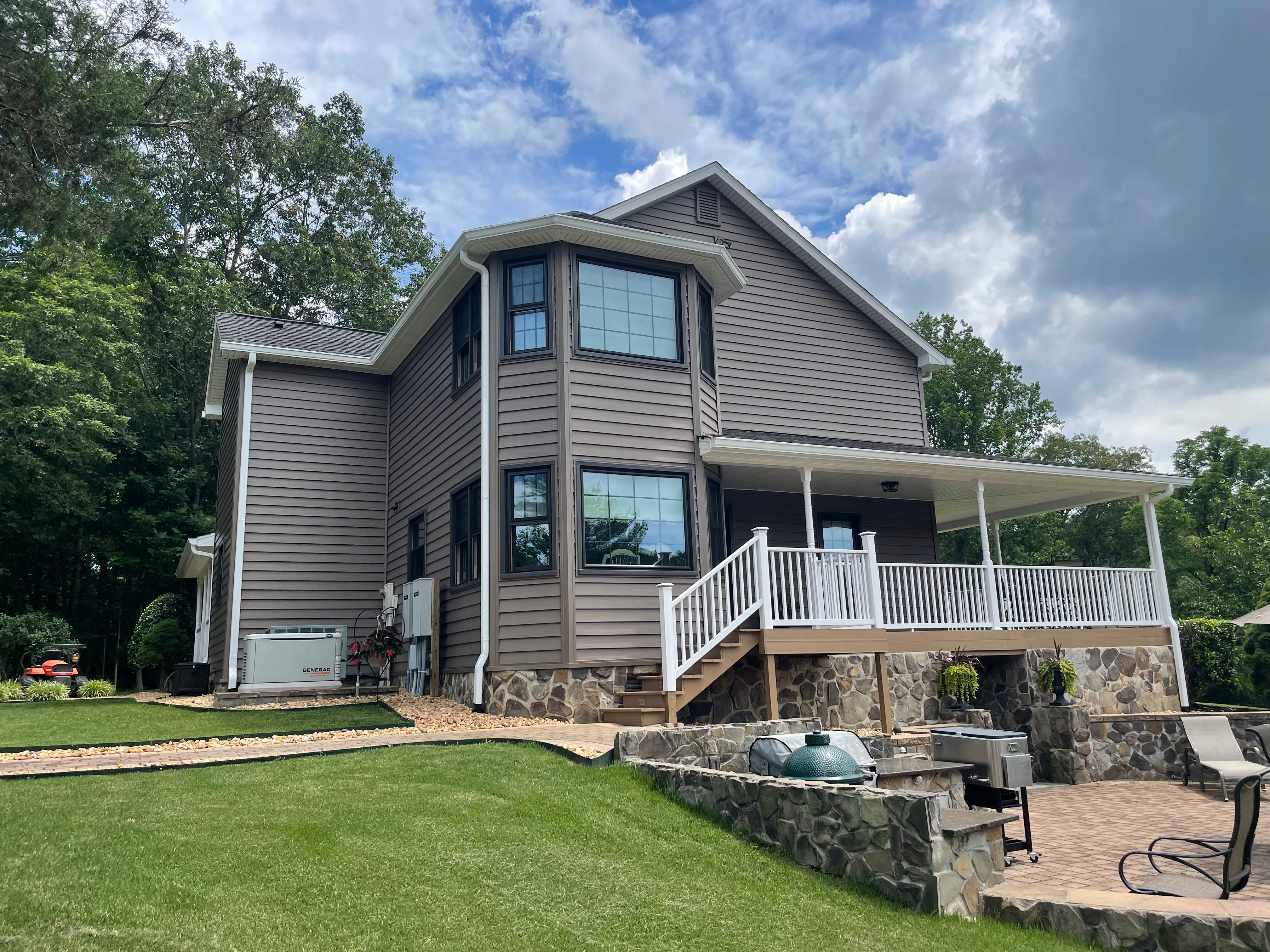 Exterior remodel including window replacement by American Home Contractors