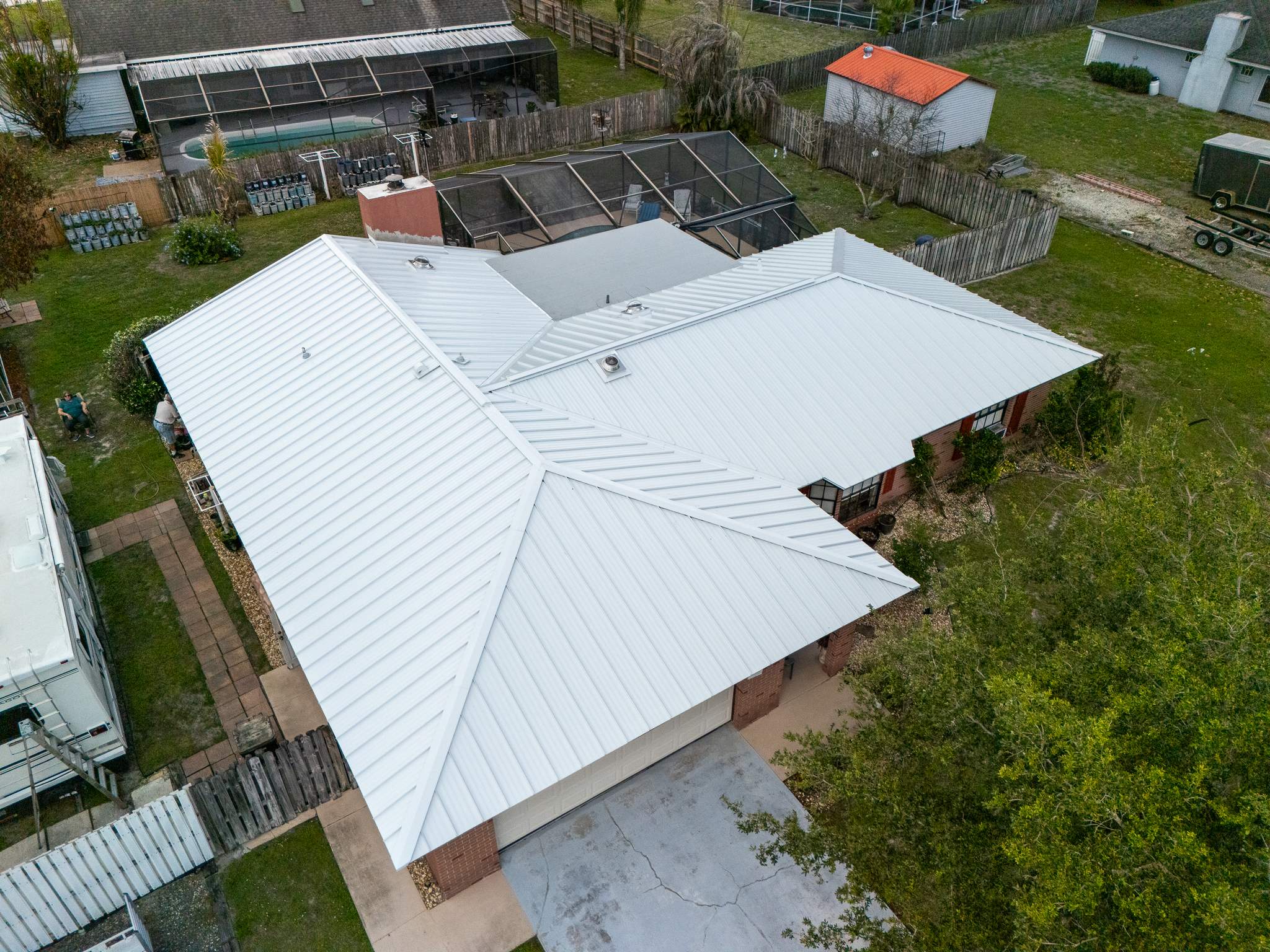 White Standing Seam Metal Roof Replacement and Hurricane Reinforcement in Palm Bay, Florida by Wiedmann Construction & Roofing