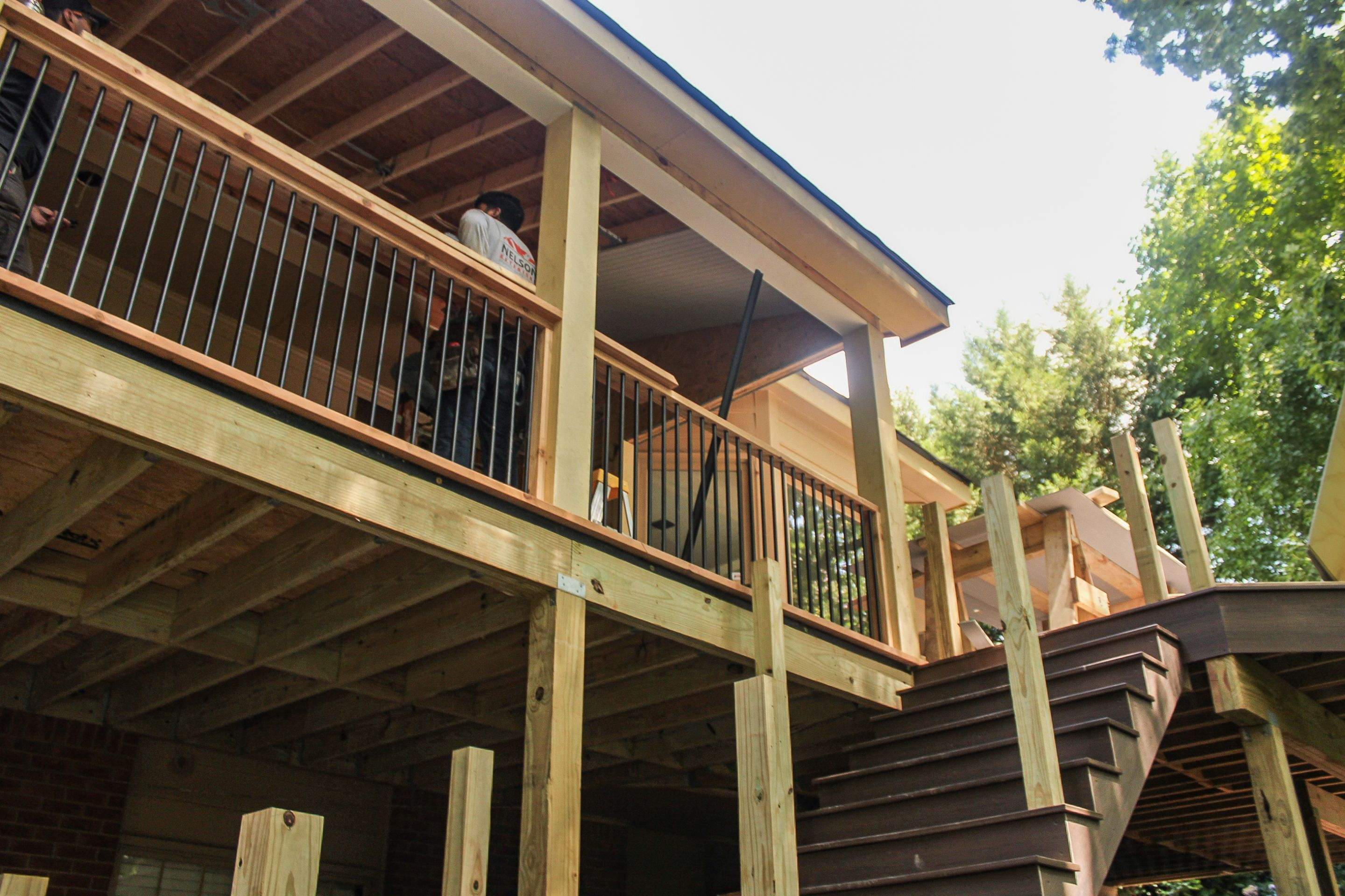 Deckorators Voyage Deck and Shed Style Covered Porch Build with Drink Rail by Nelson Exteriors 