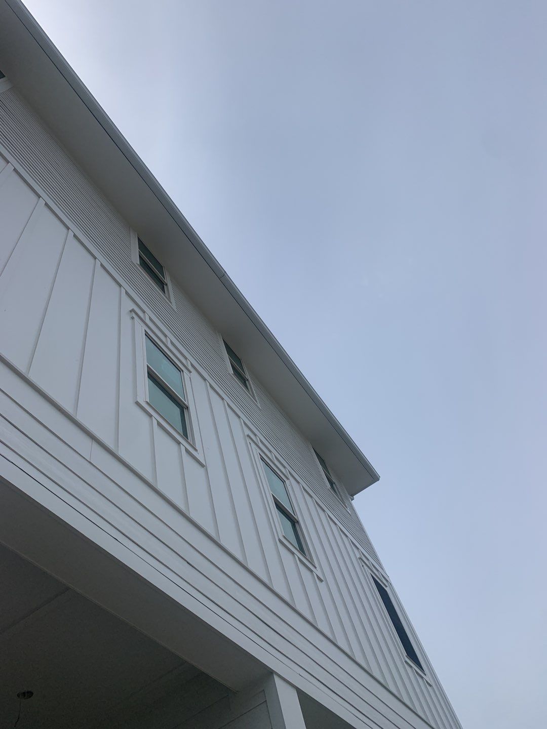 Downspout Installation for Multi-Story Building in Panama City FL by Gutter Professors