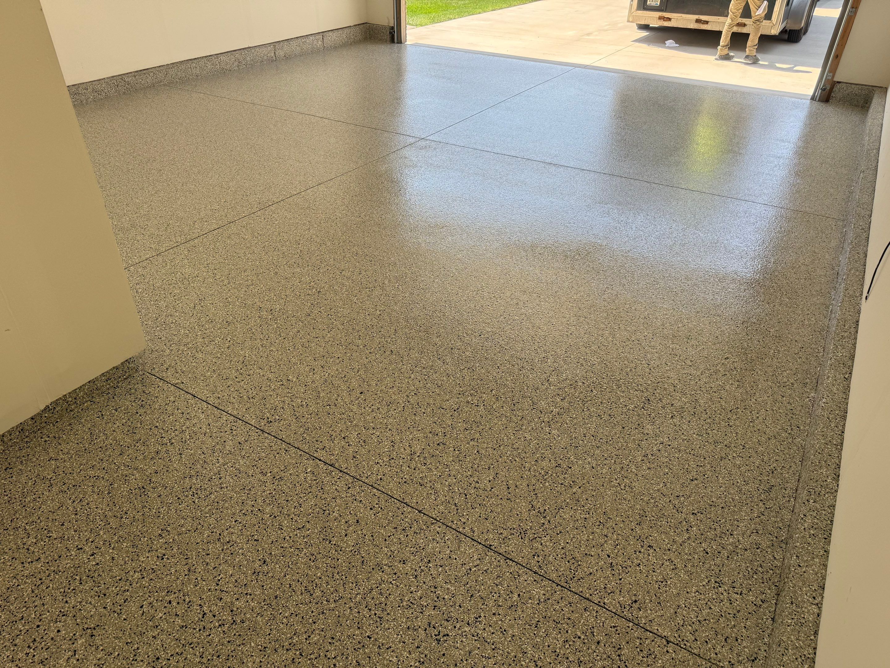 Cabin Fever Garage Floor Coating in Sioux Falls by Select Painting, Coatings & Garage Cabinets