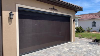 Bronze rolling screen with hurricane fabric