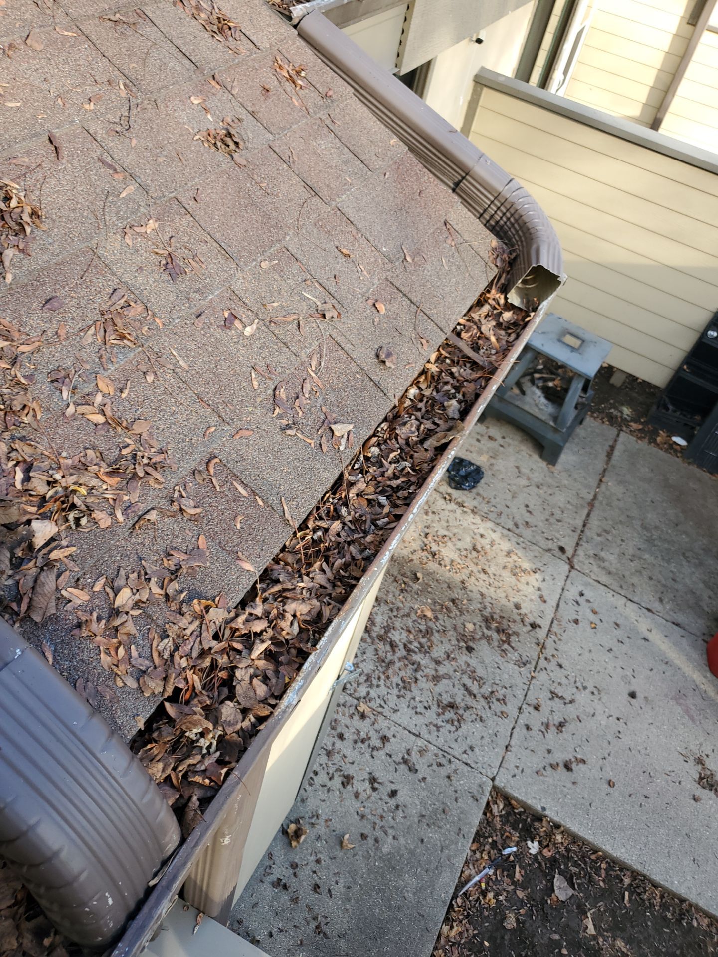 Commercial gutter cleaning Milwaukee before photo with filled gutters