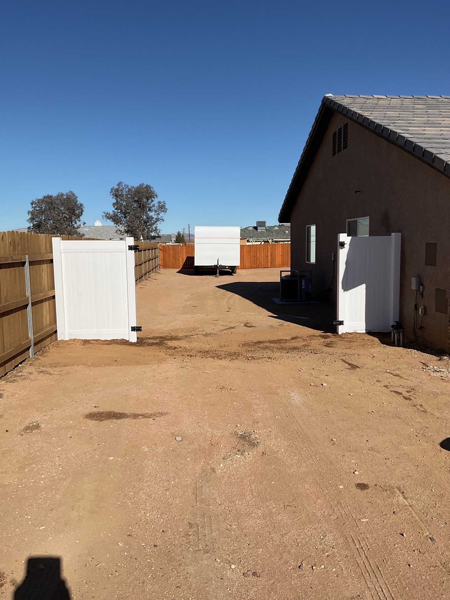 Gate installation using Vinyl by Fence Guys Inc. 