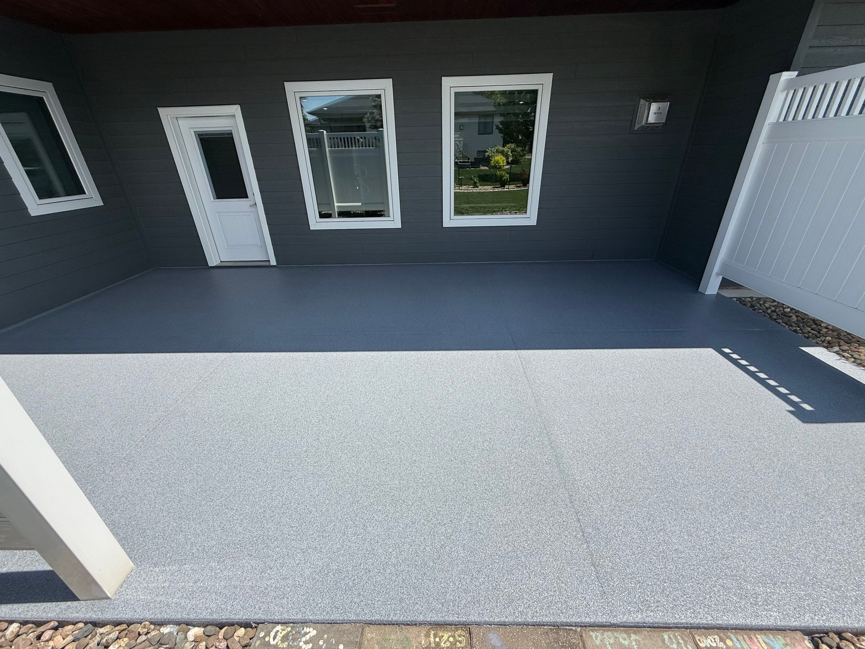 Polyurea Patio Floor Coating in Starry Evening for Sioux Falls Home by Select Painting, Coatings & Garage Cabinets