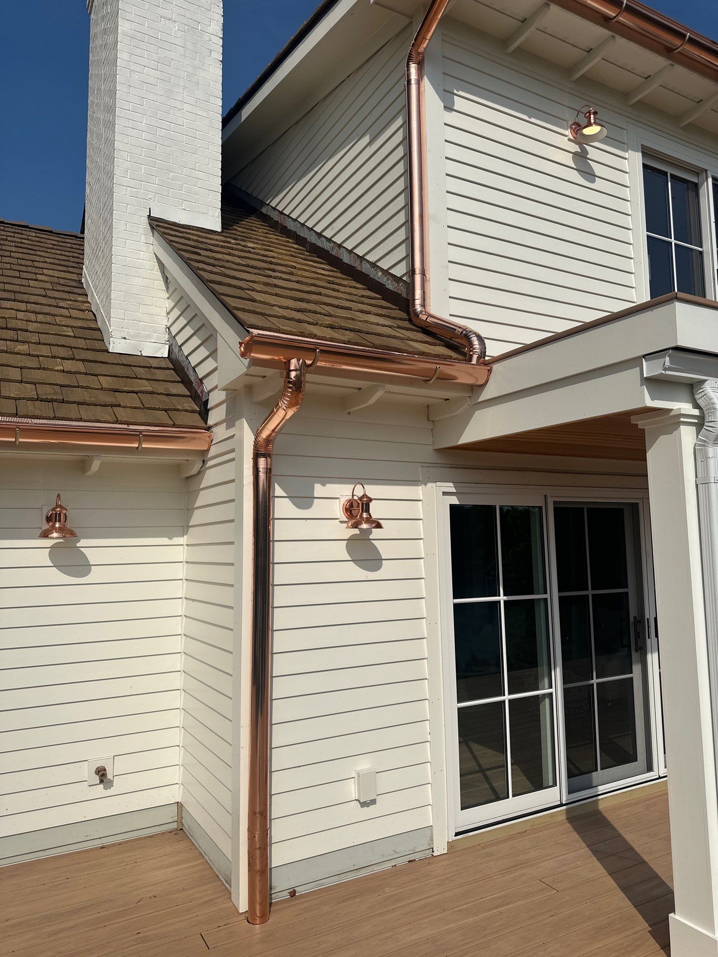Custom Copper Gutter System and Accent Roofing in East Jordan by Rainbow Seamless Systems
