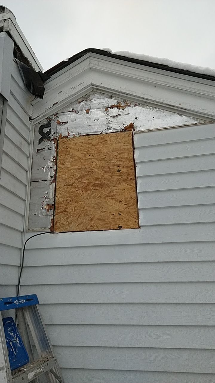 James Hardie Siding  using James Hardie Board and Batten, White by Absolute Roofing and Construction