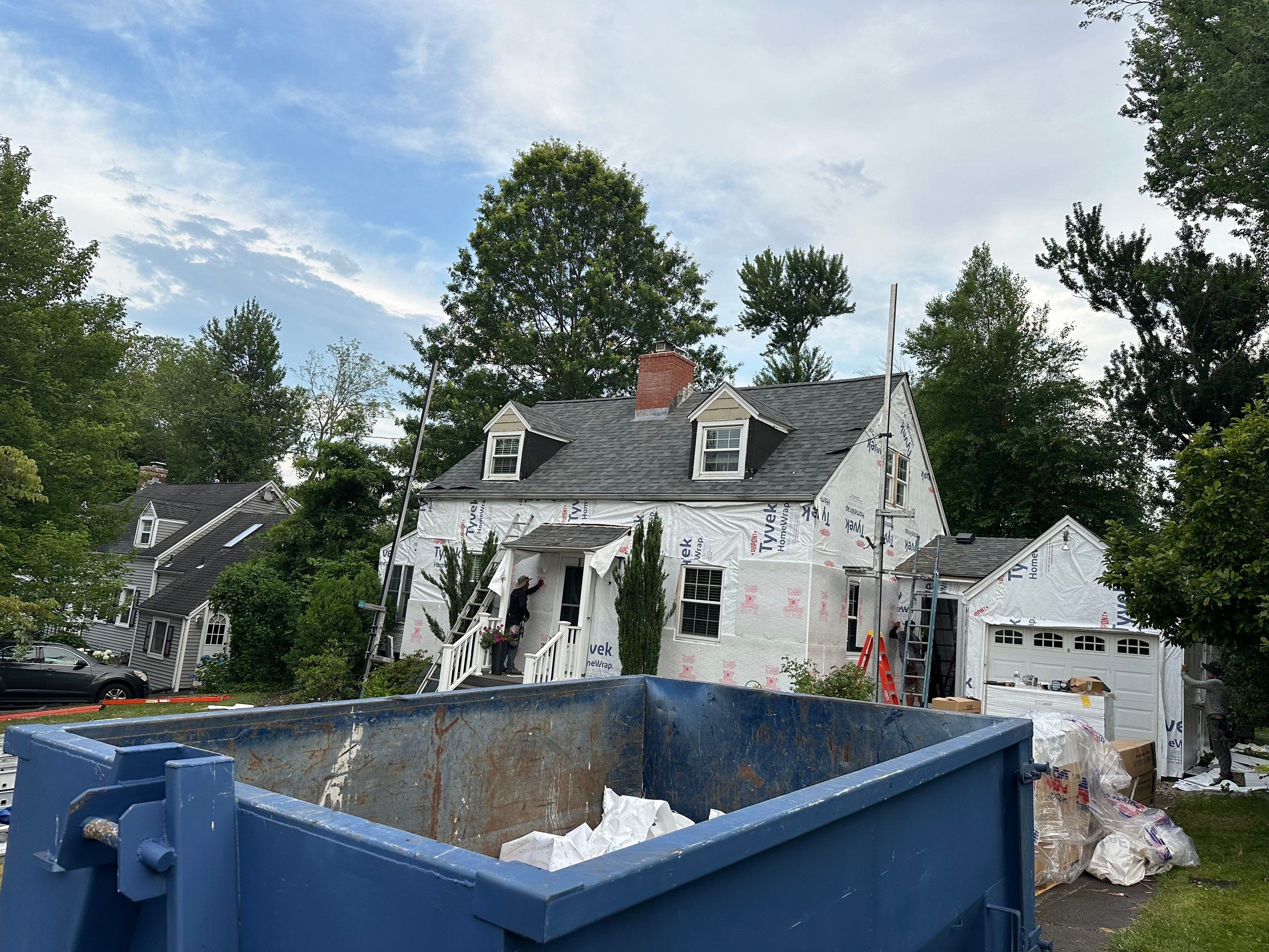 Complete Exterior Estate gray with Pacific Blue Siding by A Plus Exterior