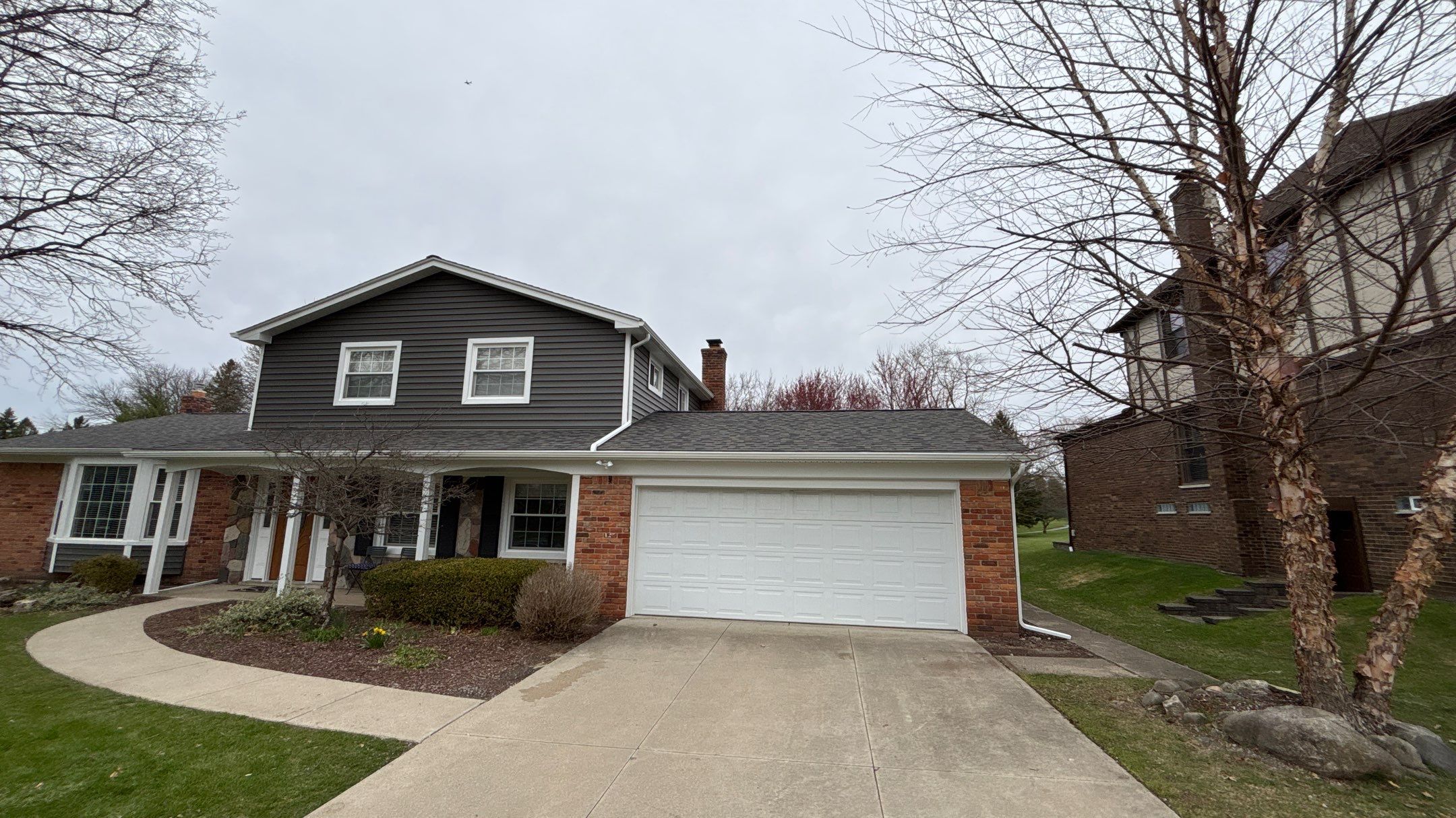 Siding Replacement using Alside Charcoal Smoke and Roof Replacement using Owens Corning Peppercorn by 180 Contractors