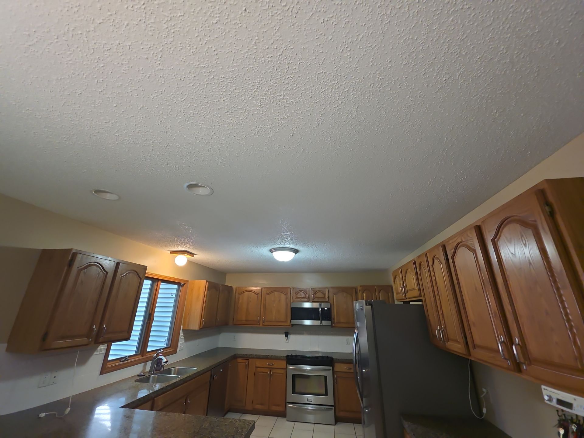 Norton Shores Kitchen Cabinet Painting and Deck Restoration Project by Gordon Painting
