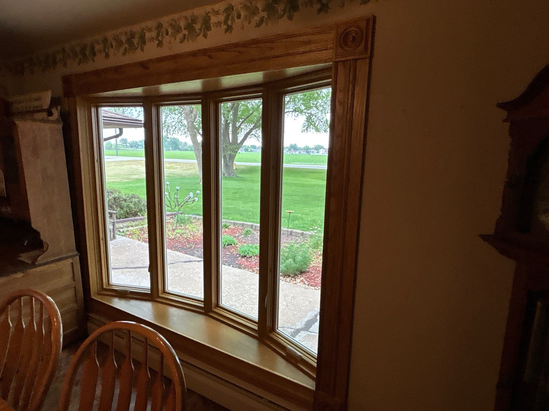Bow window replacment using Pella Lifestyle wood/Aluminum window by United Windows and Siding LLC