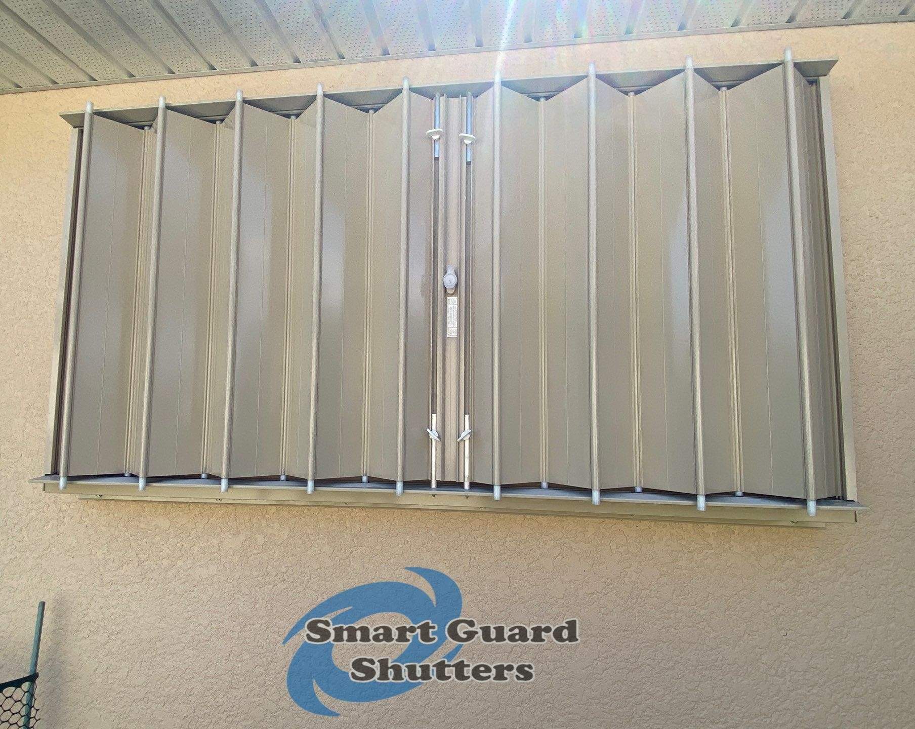 Accordions in Beige by Smart Guard Shutters