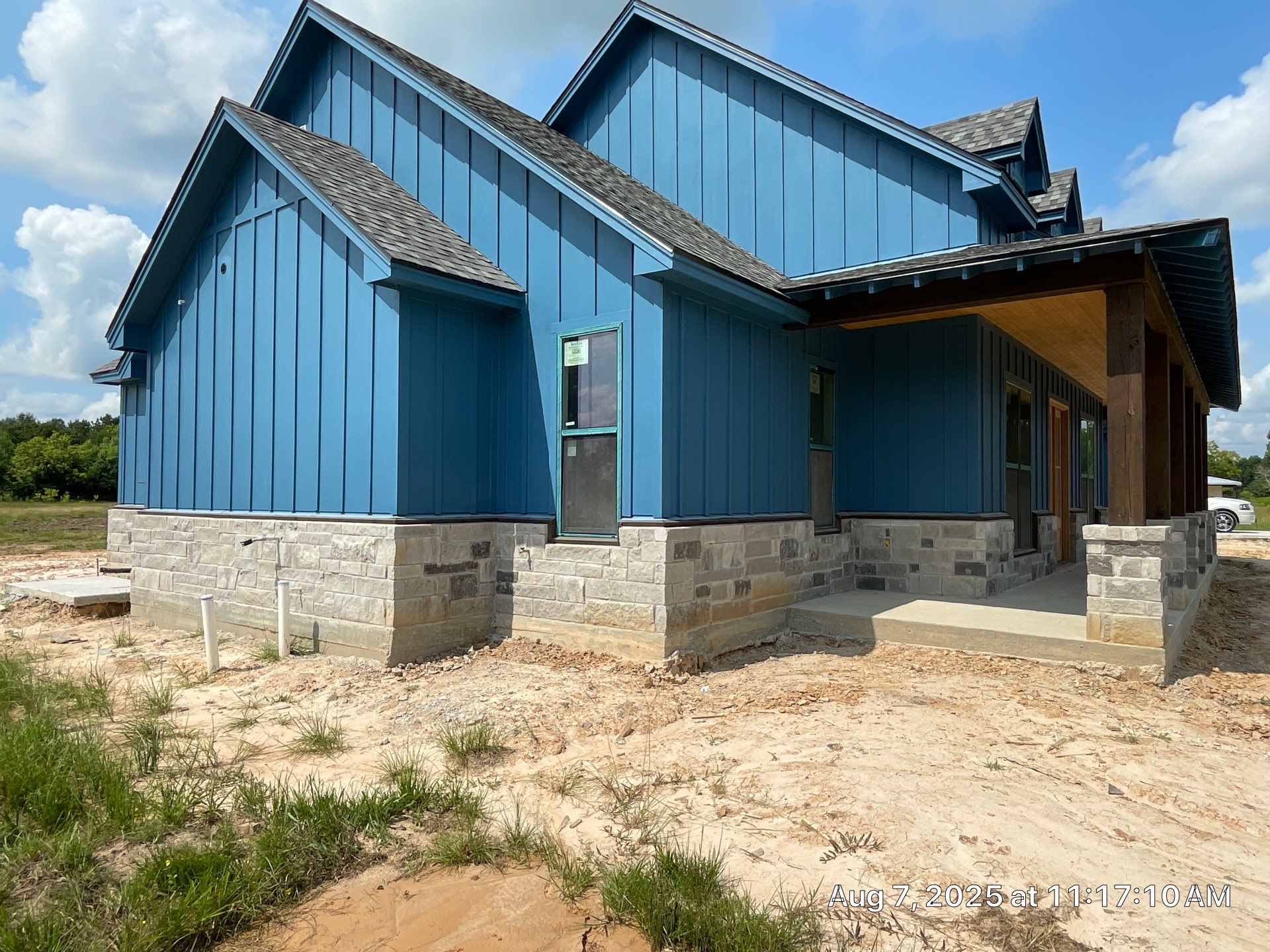 Natural Stone Elegance: Apex Installation Accented by Blue Siding by Apex Conventional Stucco Llc
