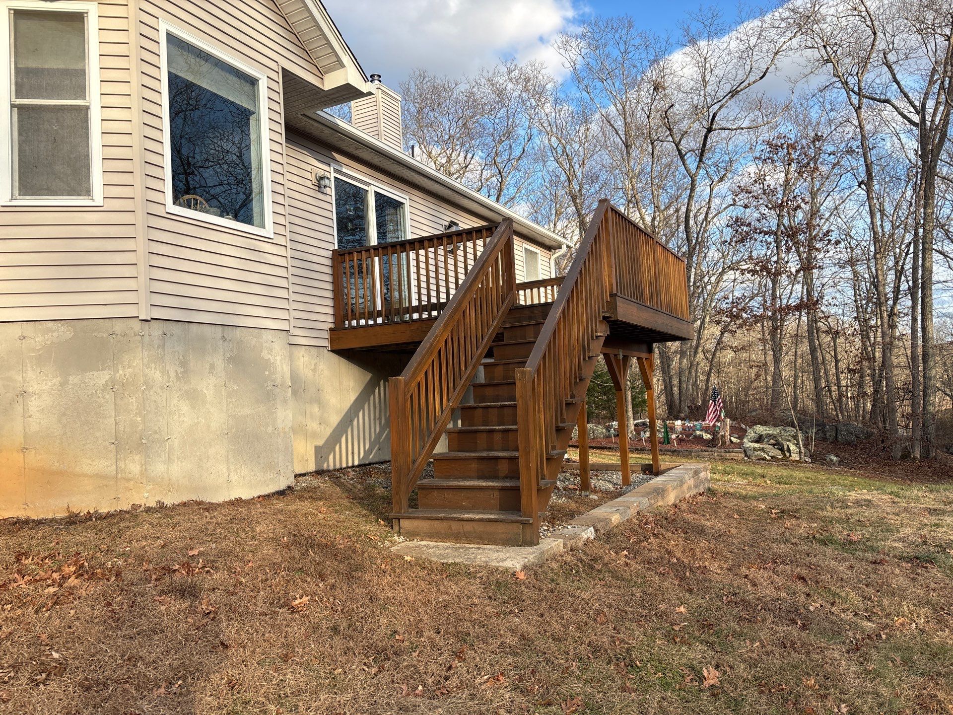 Replacement deck using Trex Transcend Ropeswing and White Transcend railings, with gate by DiGiorgi Roofing and Siding Inc