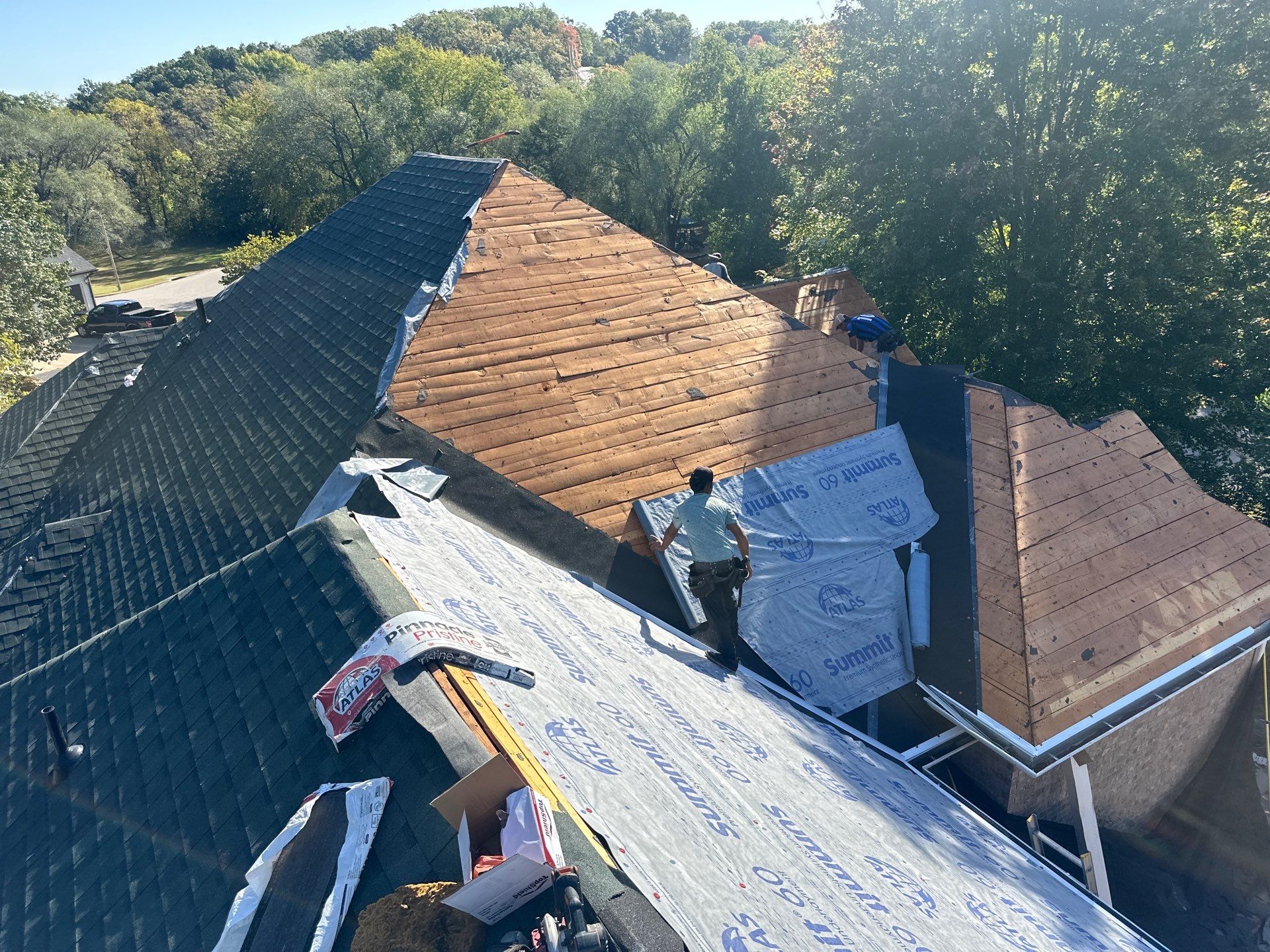 Residential Roofing Install - Green Atlas Pinnacle Pristine Shingles - White Gutters & Downspouts  by Titan Commercial & Residential Roofing 