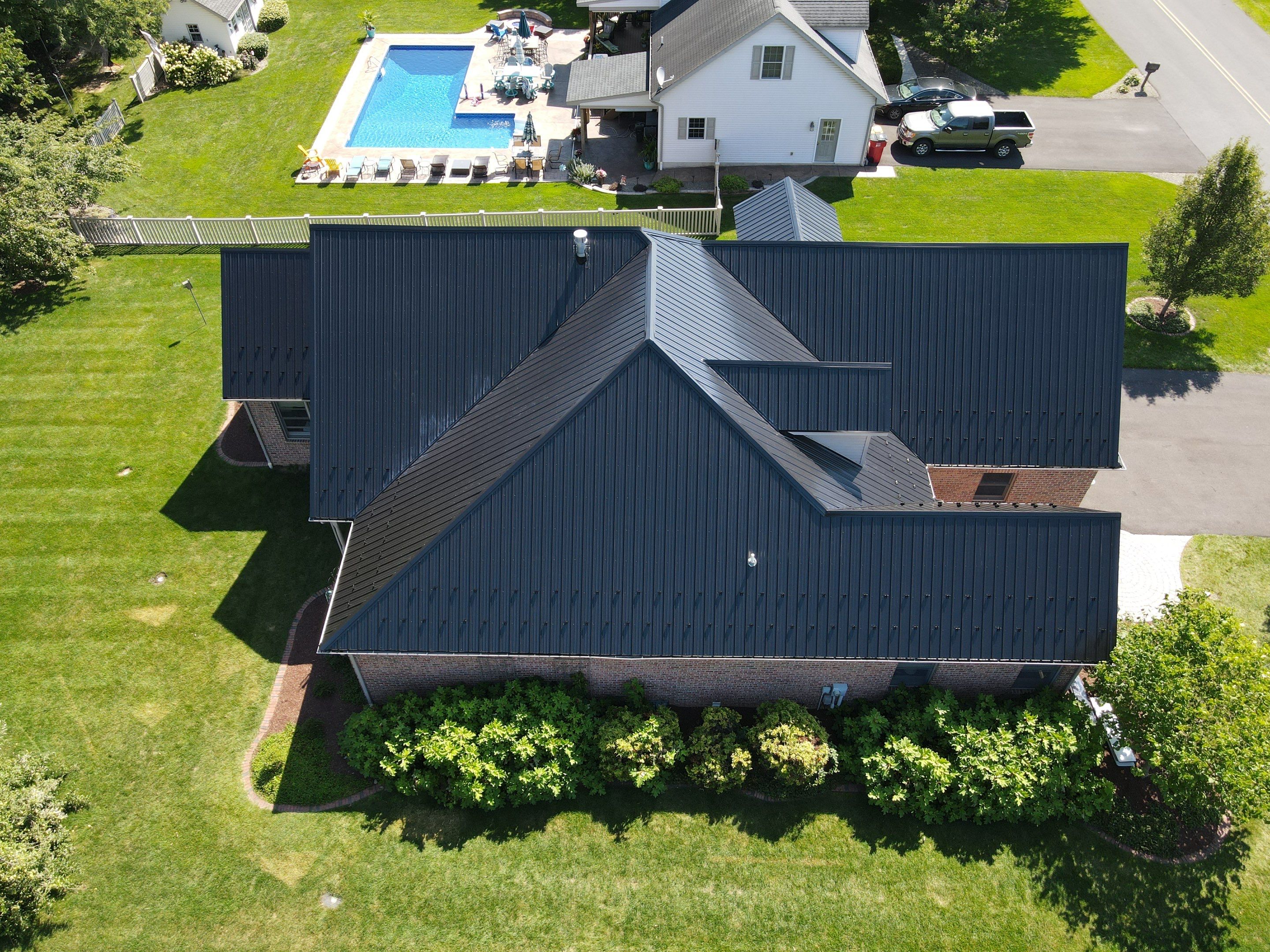 Standing seam / Azm panel in black  by Teflon Roofing