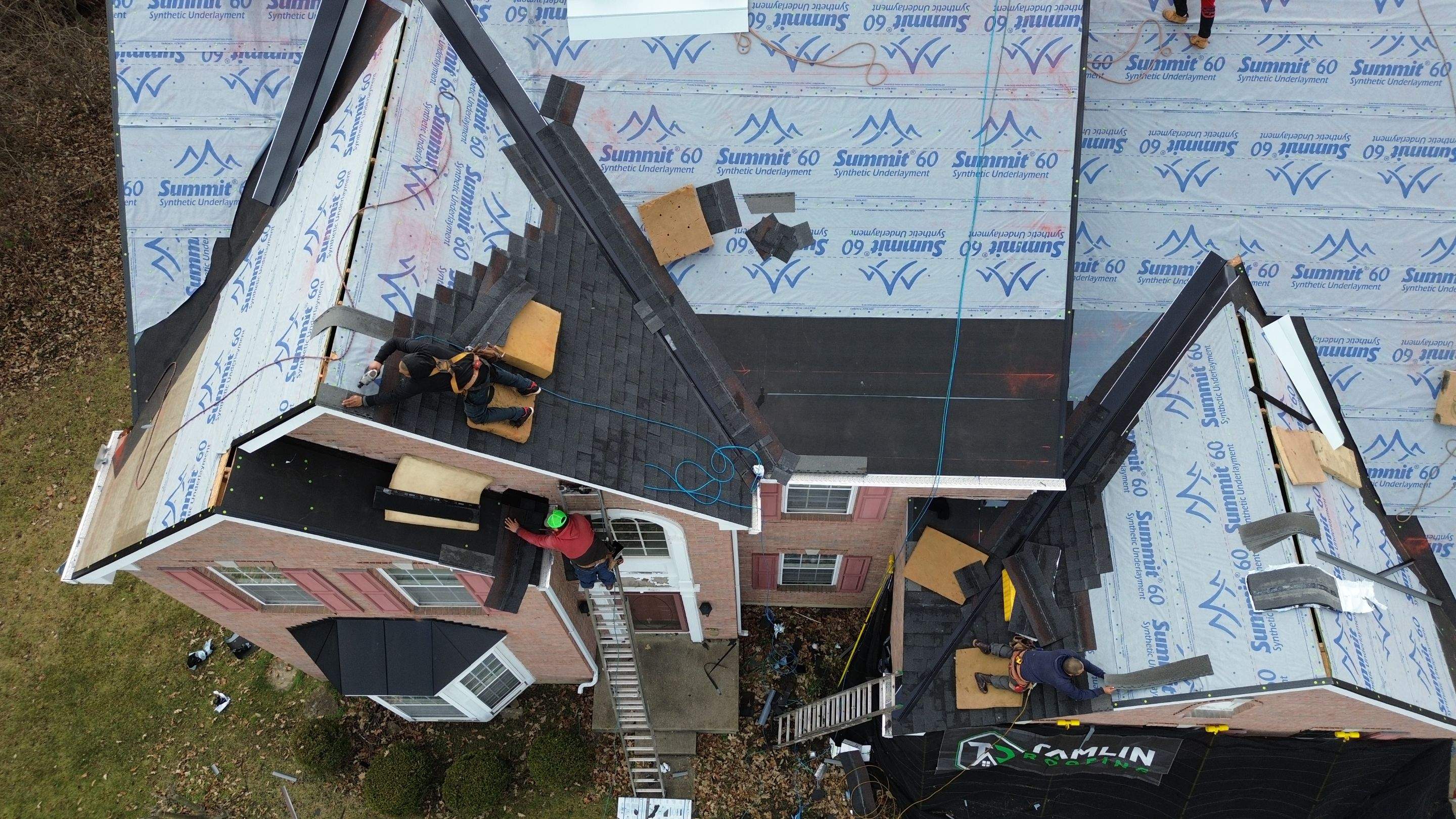 Walden Ponds - Pristine Black and Hydro Flo Gutter Guards by Tamlin Roofing