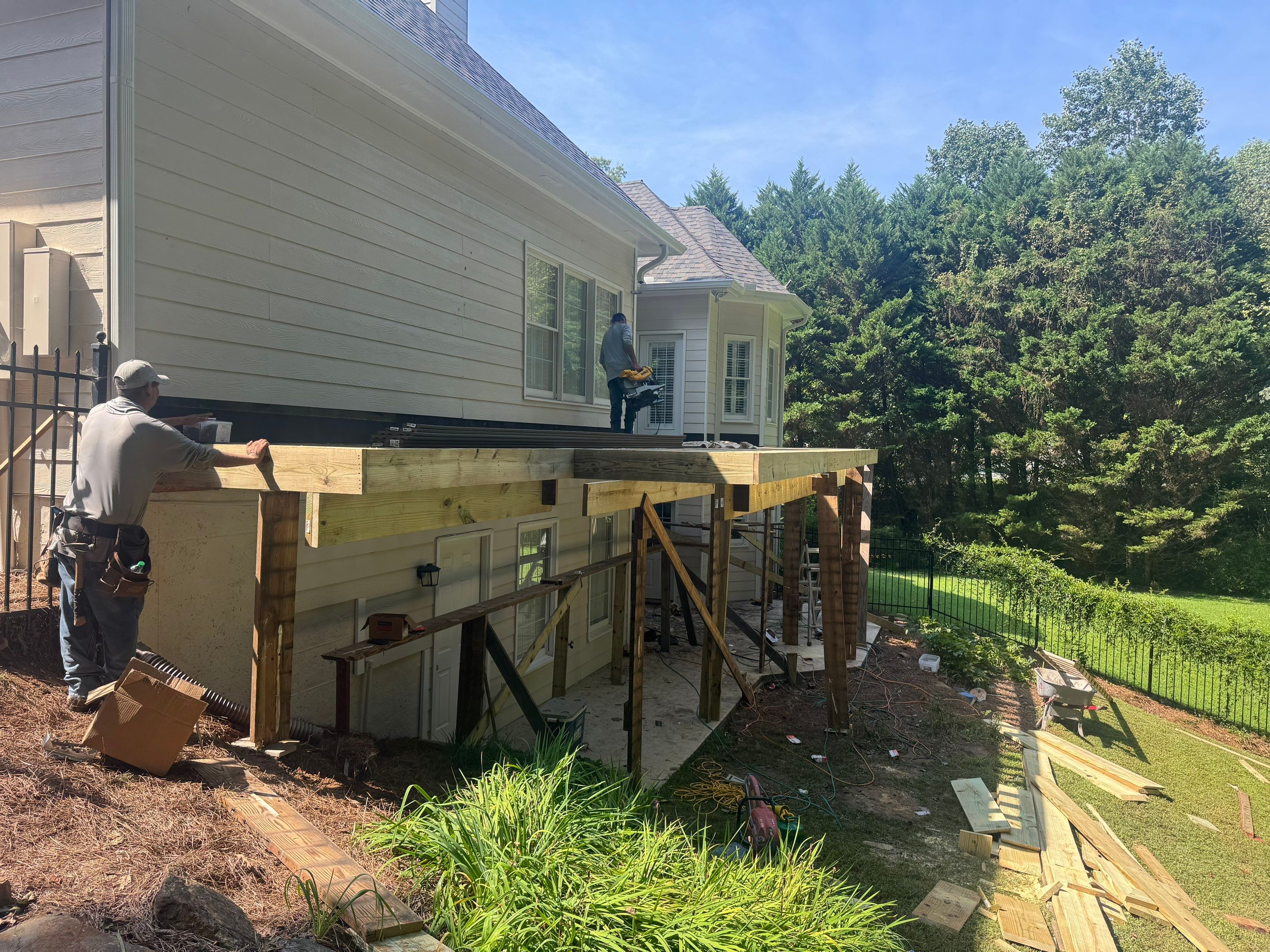 Elevated Composite Deck Replacement with Metal Railings in Smyrna by Swift Home Renovations 