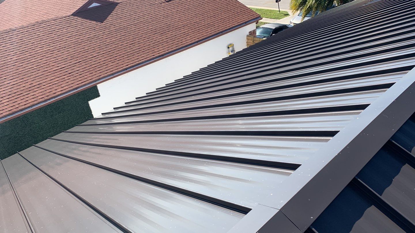 Residential Roofing Installation using 1" Nail strip metal roof by BLUES BROTHERS CONSTRUCTION CORP