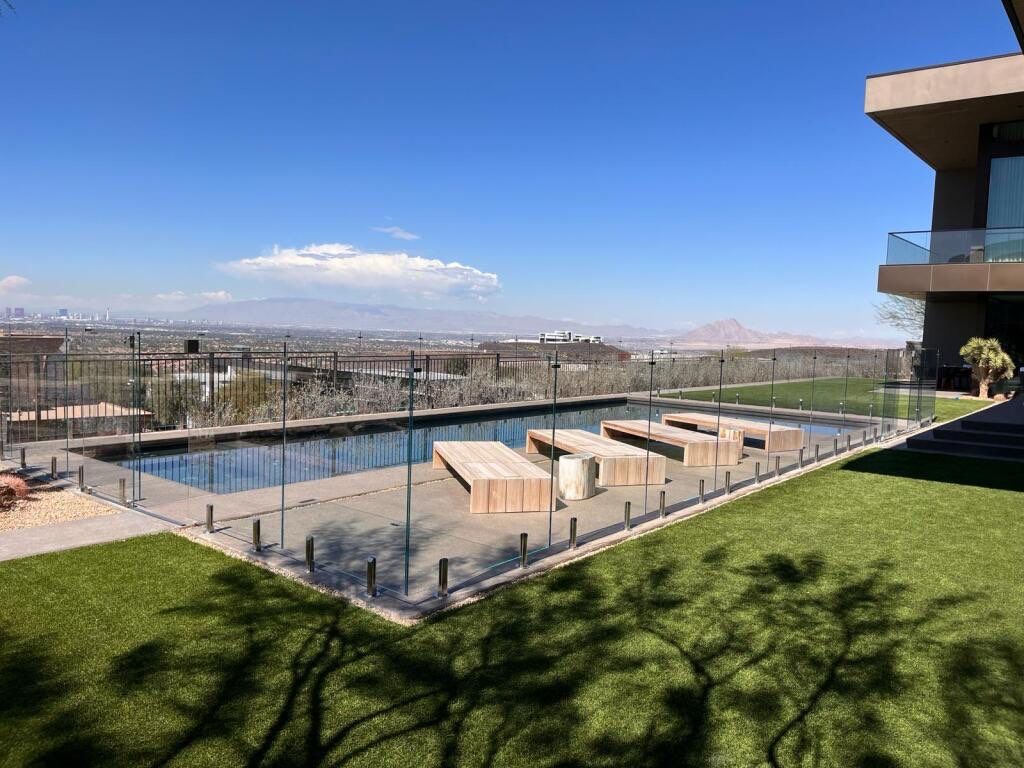 Exterior wood refinish & glass pool enclosure by Level Builders