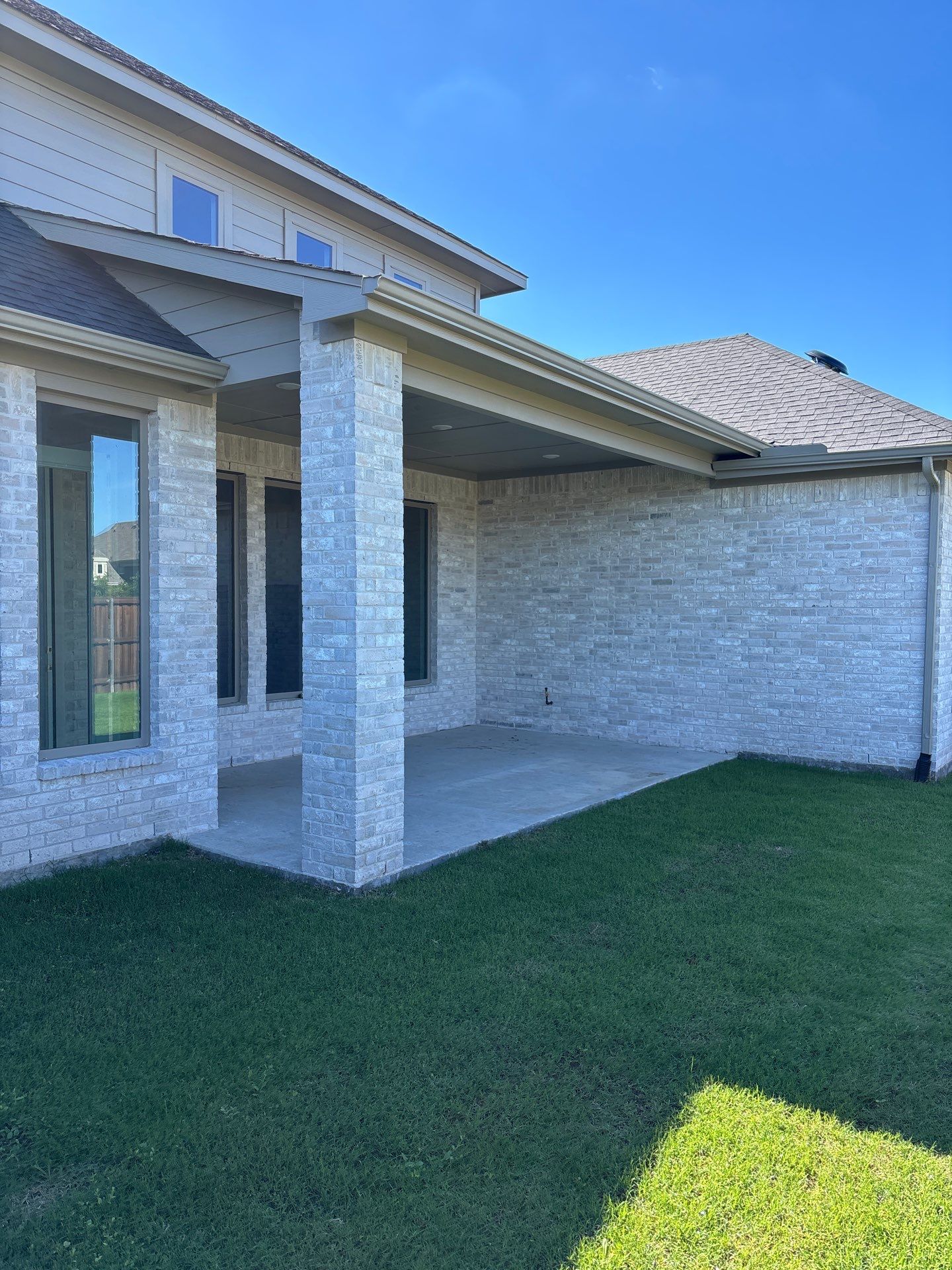 Year-Round Bonus Room: Patio Enclosure Featuring 16ft Seamless Sliding Glass by Tibi Soli LLC