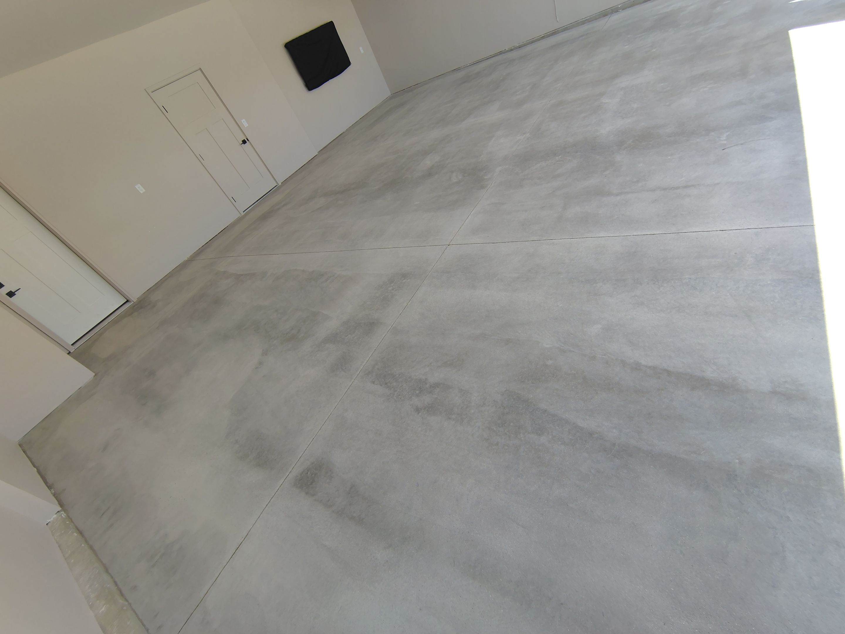 Full Speckled Concrete Coating for Sioux Falls Garage by Select Painting, Coatings & Garage Cabinets
